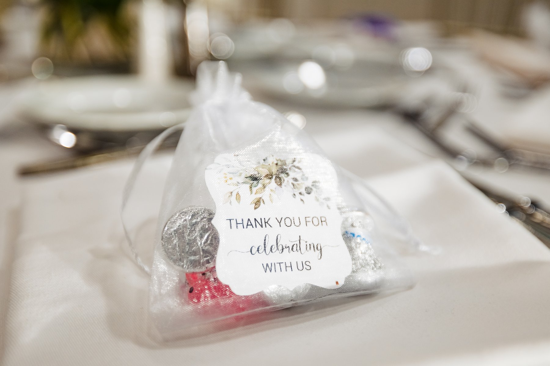 Wedding favor at the reception, a small organza bag with a hand-tied tag