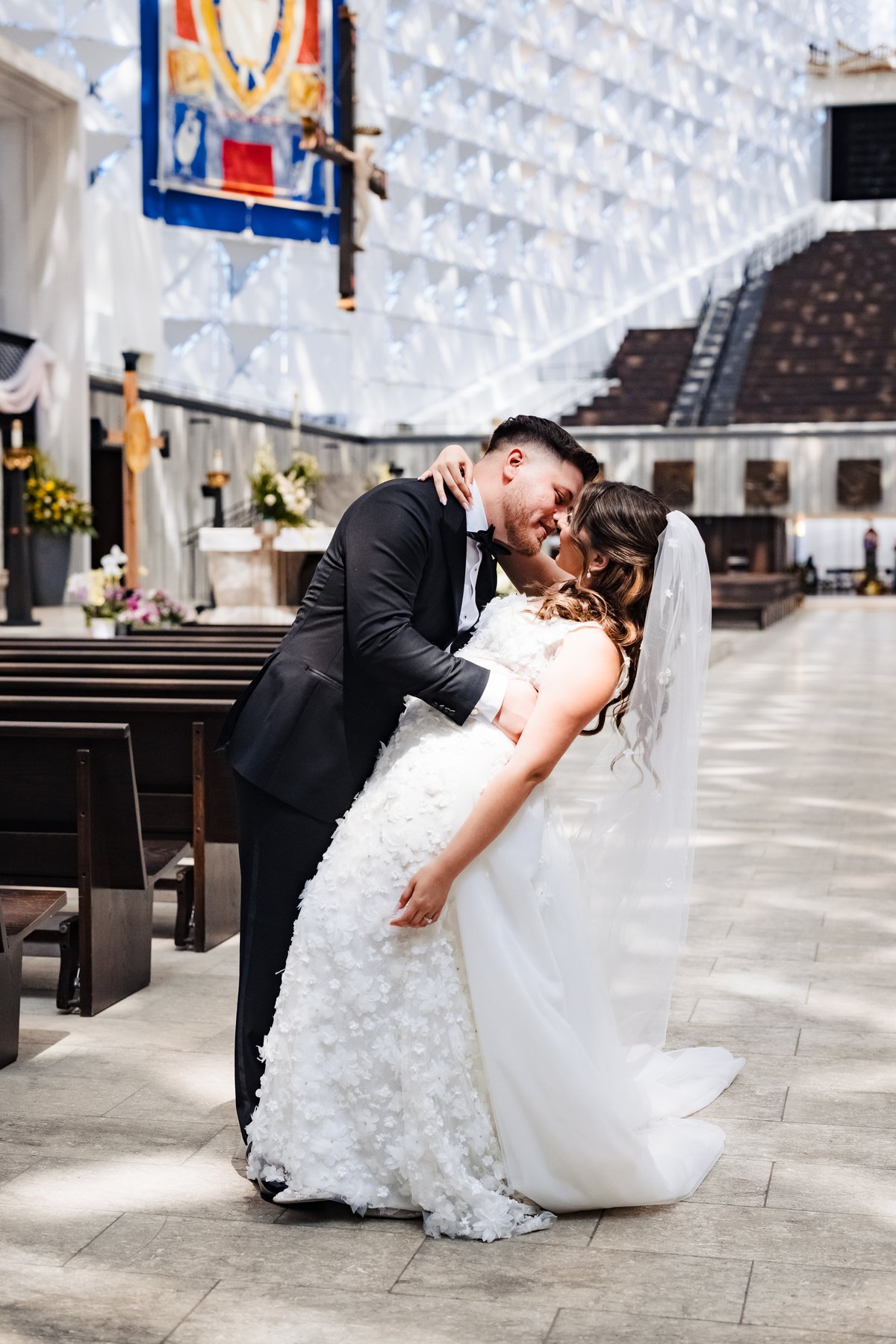 Wedding portrait of the couple inside Christ Cathedral after the Nuptial Mass