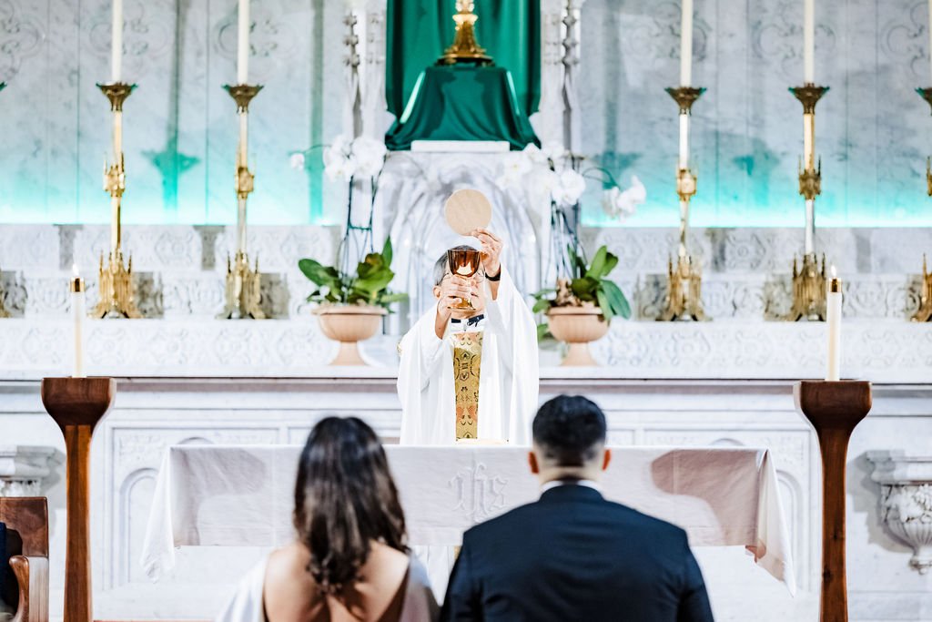 The consecration during a Catholic Nuptial Mass at Old St. Mary's Cathedral, San Francisco