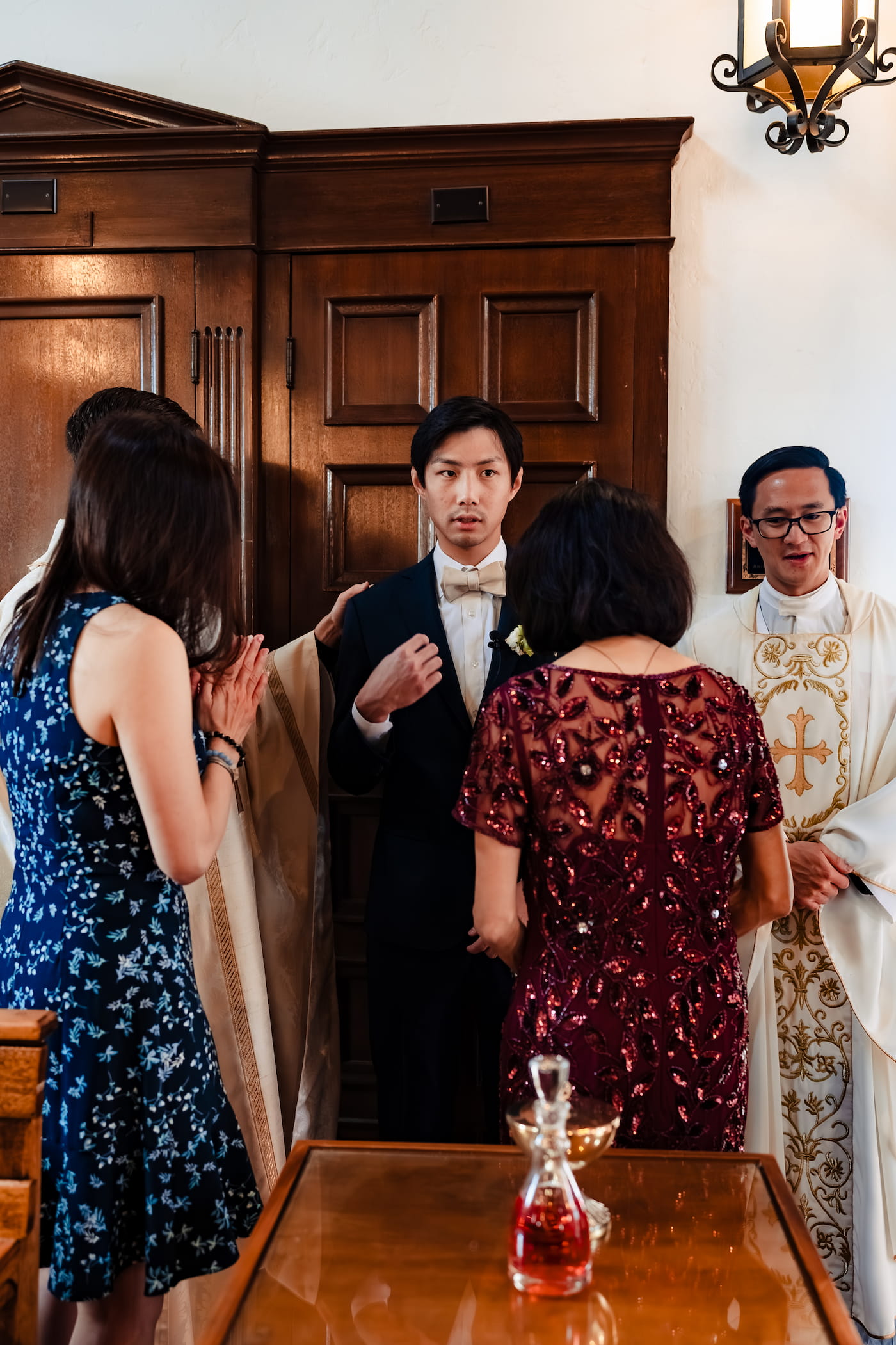 Matthew and Maya's Catholic wedding at St. Mary's Star of the Sea in La Jolla — the bride entering the church with her father