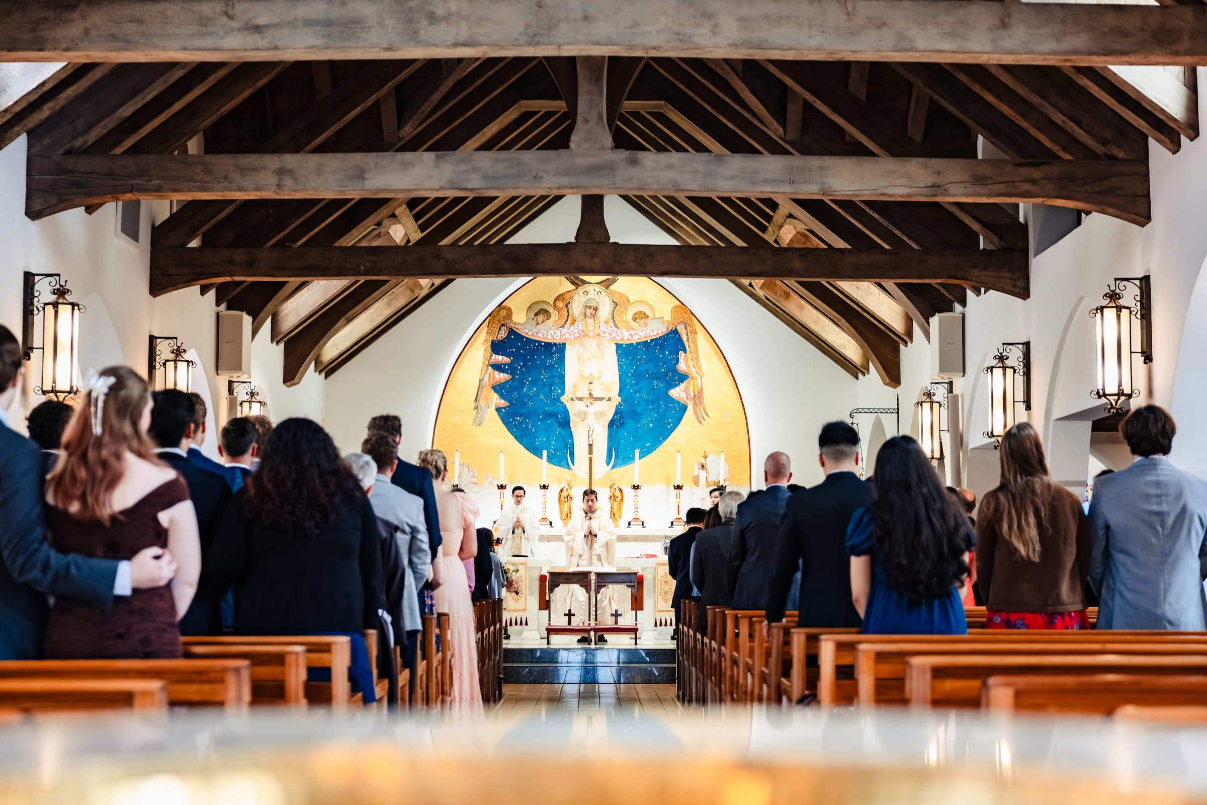 Matthew and Maya's Catholic wedding at St. Mary's Star of the Sea in La Jolla — meeting at the altar at the start of the Nuptial Mass