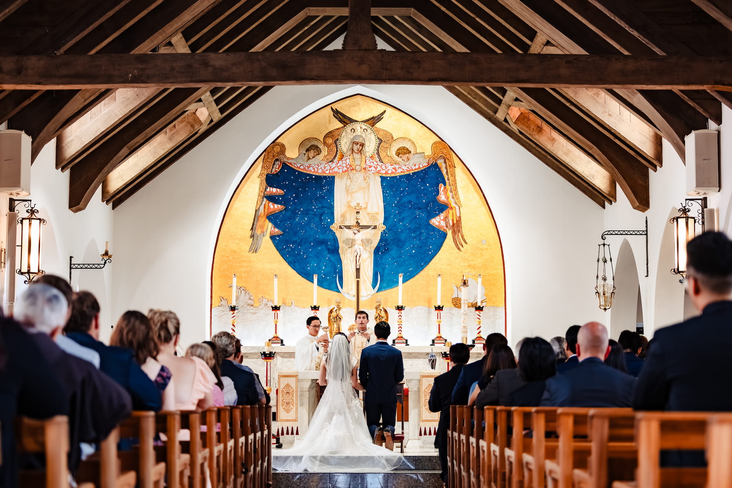 Matthew and Maya's Catholic wedding at St. Mary's Star of the Sea in La Jolla — the elevation of the host
