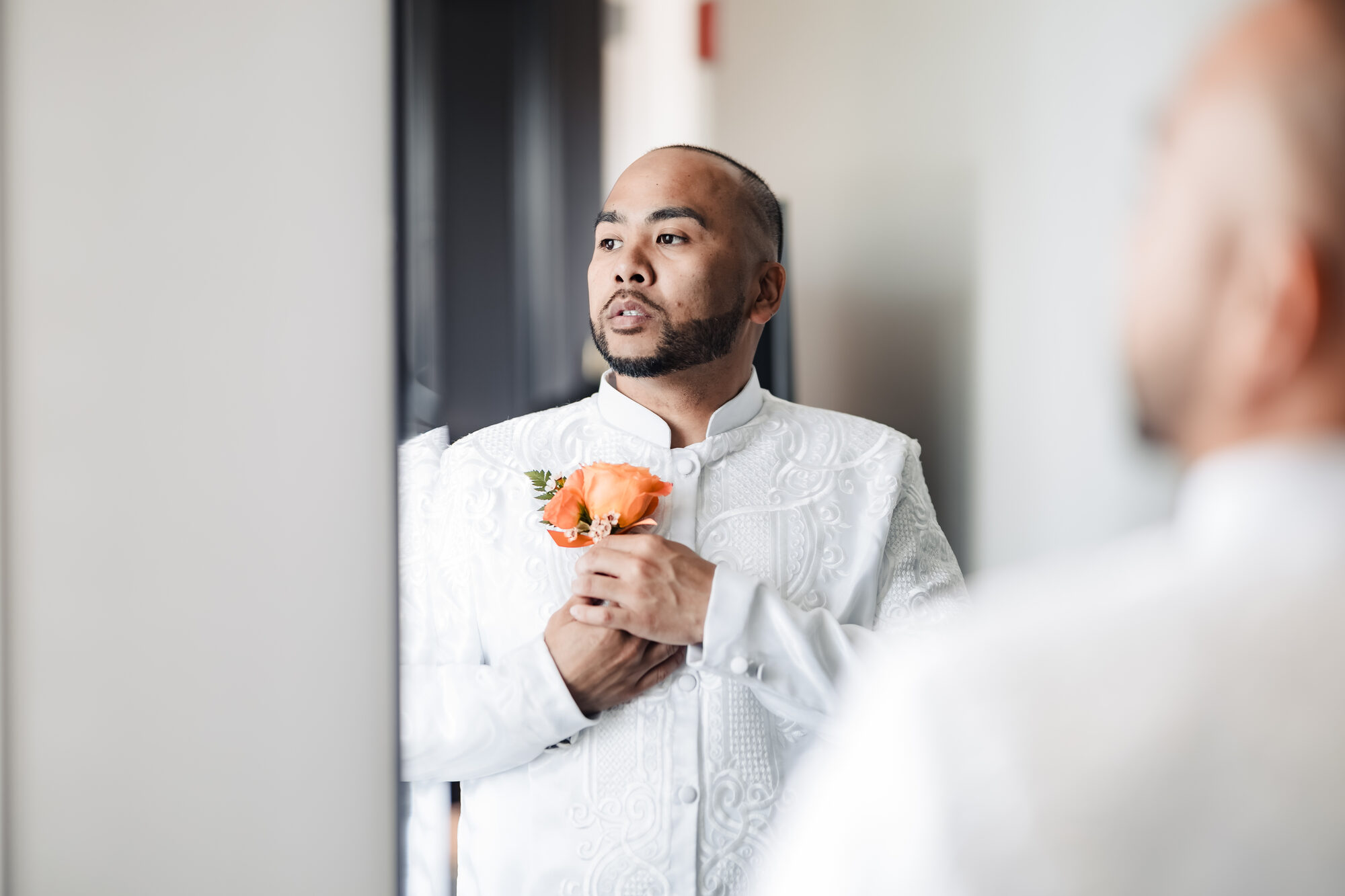 Groom preparing before his Catholic wedding ceremony, Hotel Winters