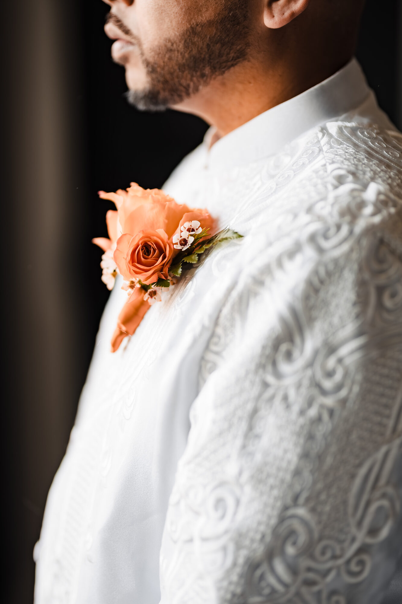Boutonniere detail before a Catholic wedding in Winters, California