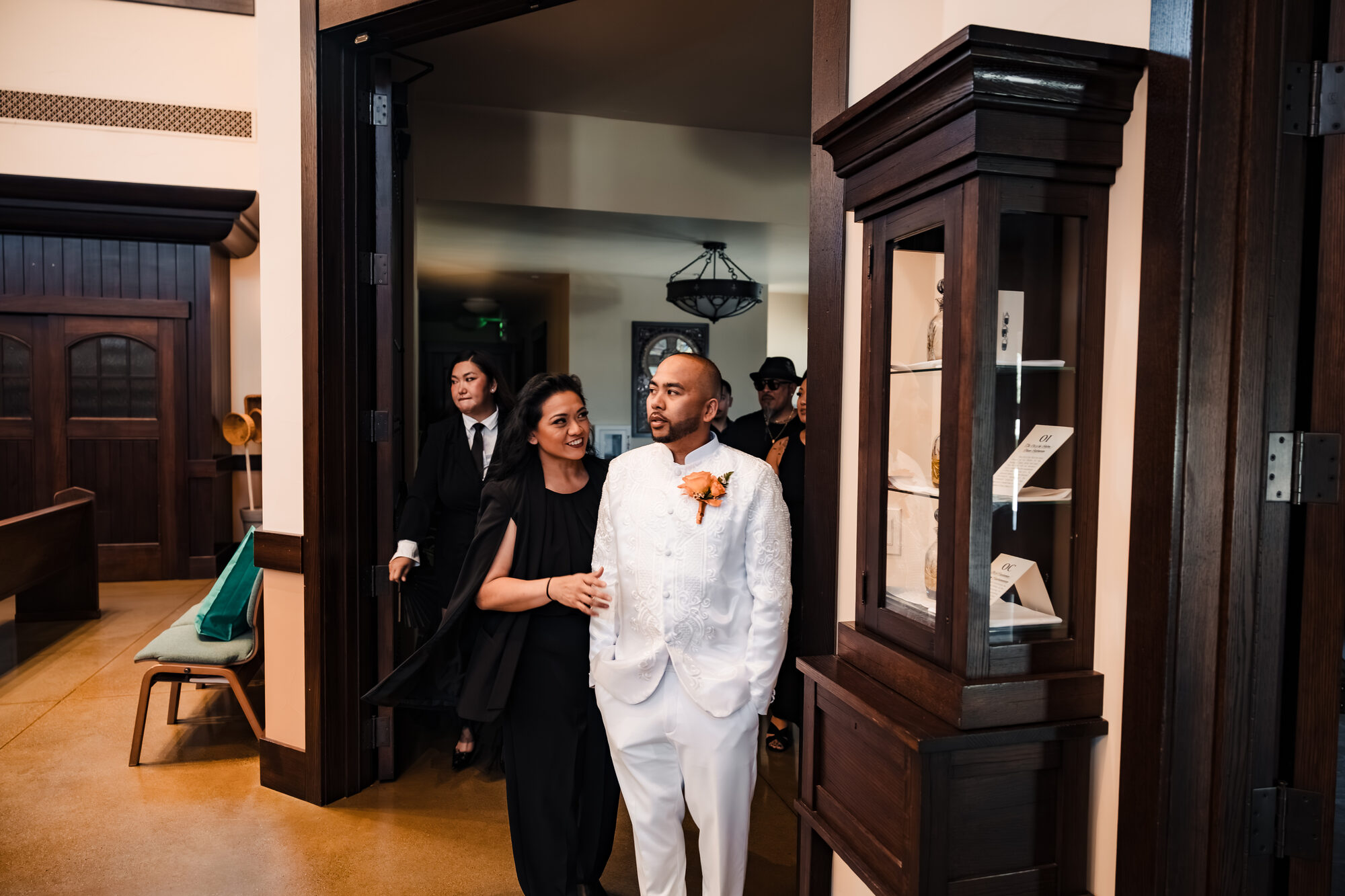 Groom arriving at the Catholic church in Winters, California with his mother
