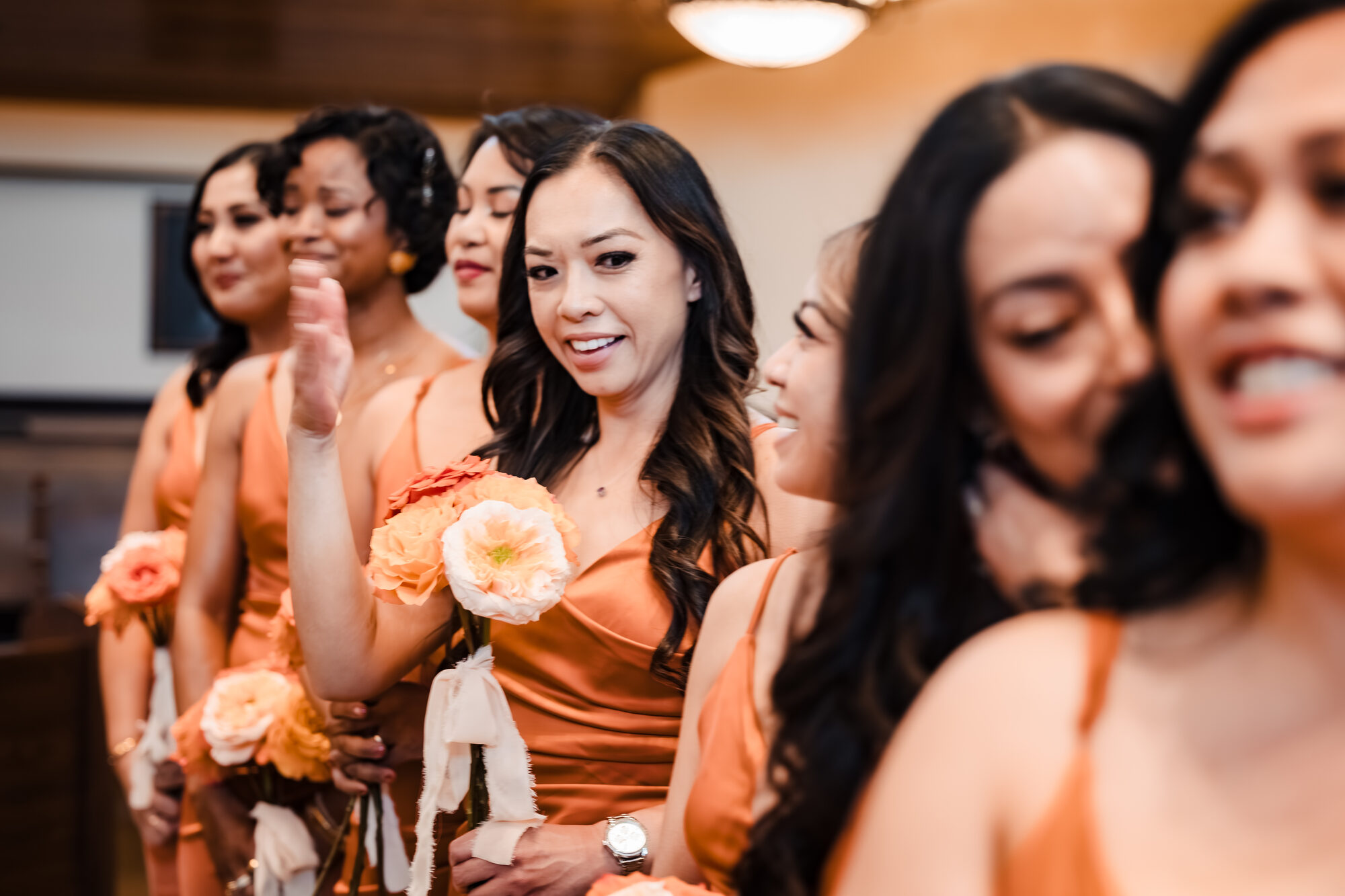 Bridesmaids processing into the Catholic nuptial Mass