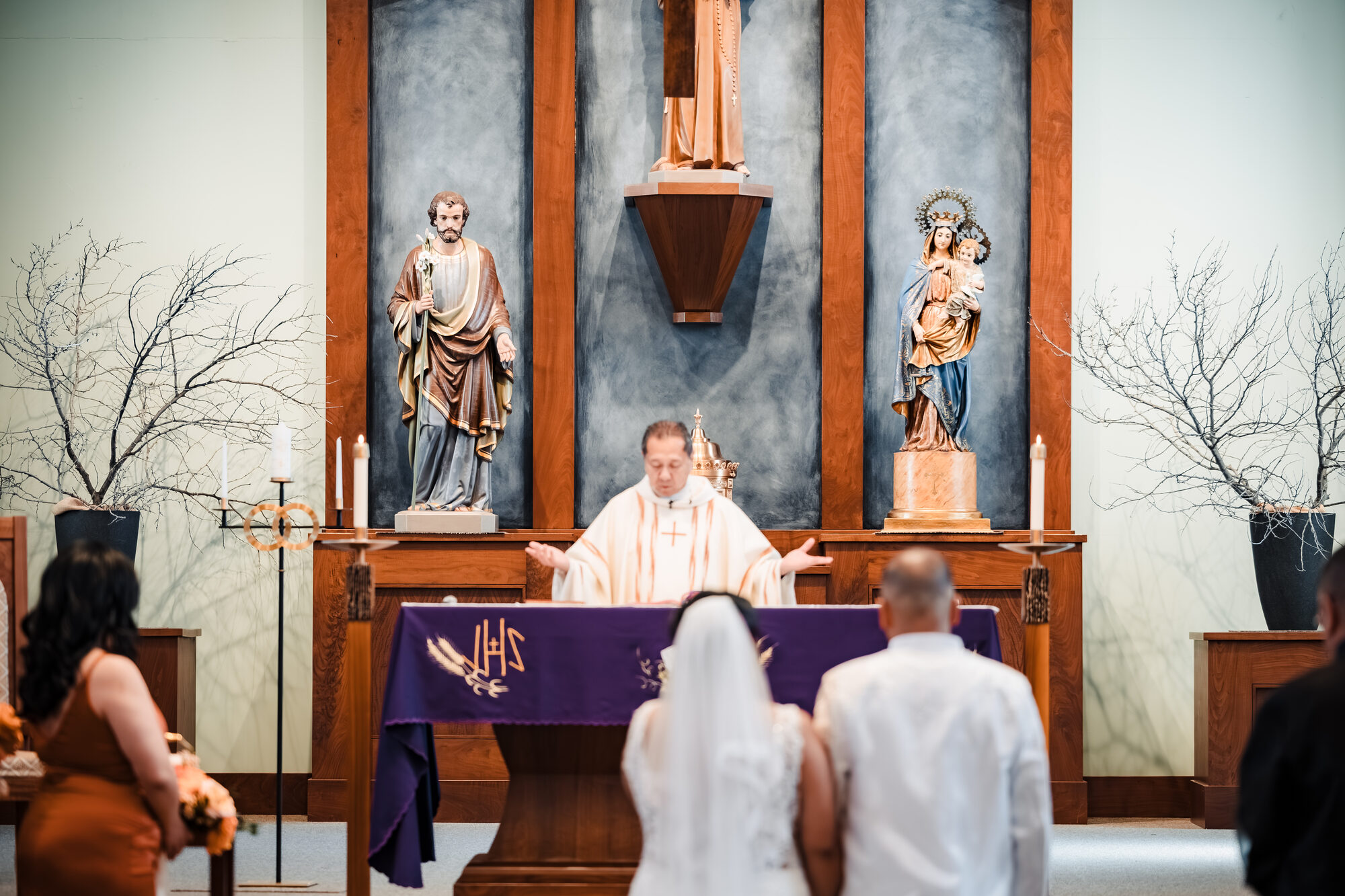 Priest at the altar during the consecration of a Catholic nuptial Mass