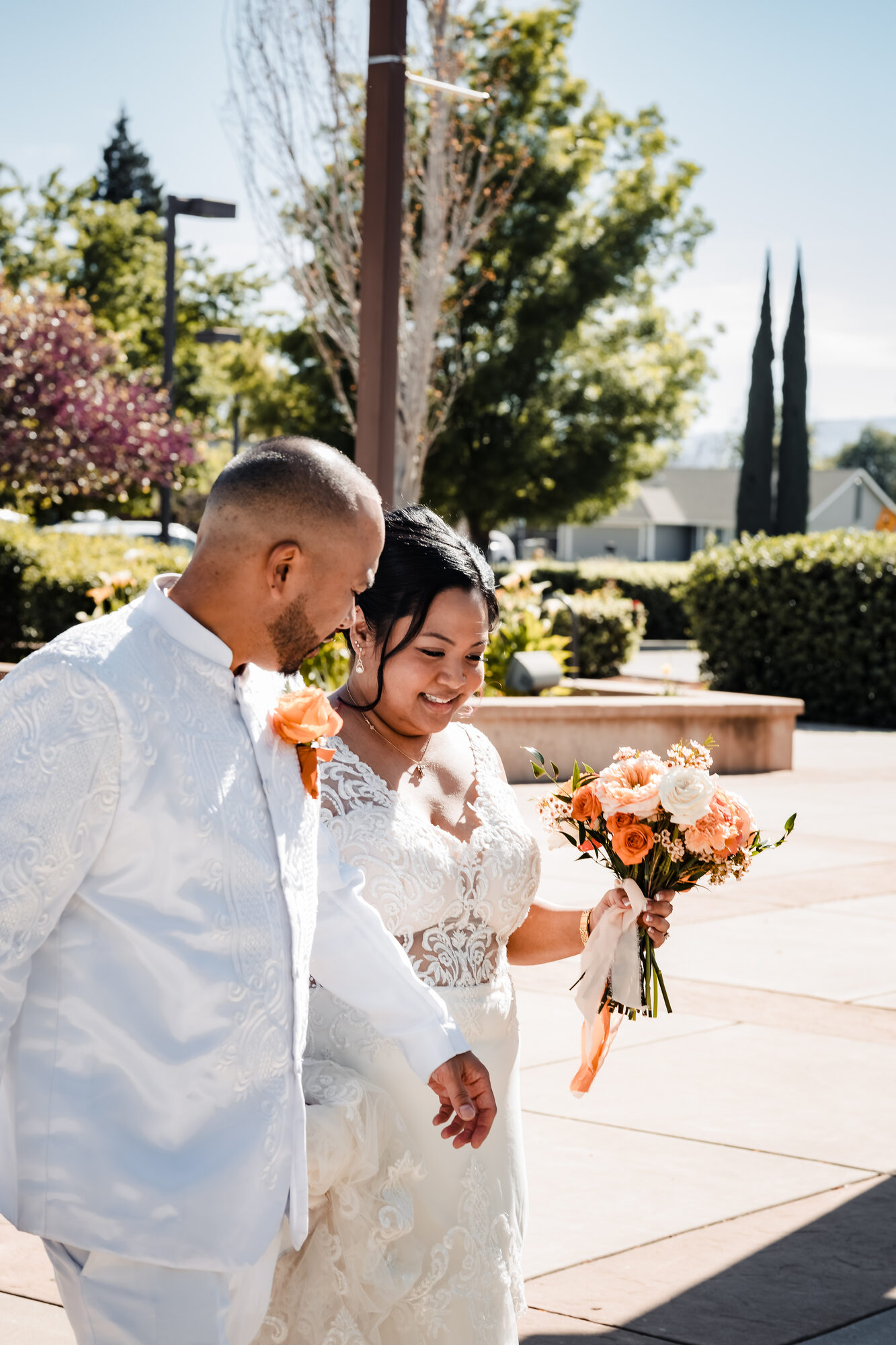 Bride and groom kneeling at the altar during their nuptial Mass in Winters, California