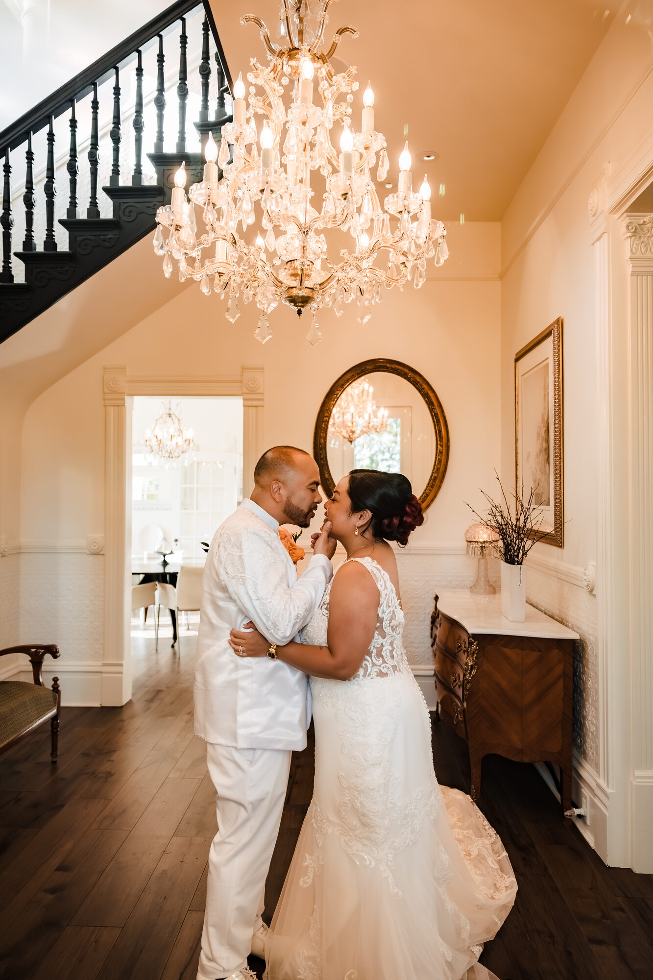 Bride and groom sharing a quiet moment under the chandelier at Park Winters
