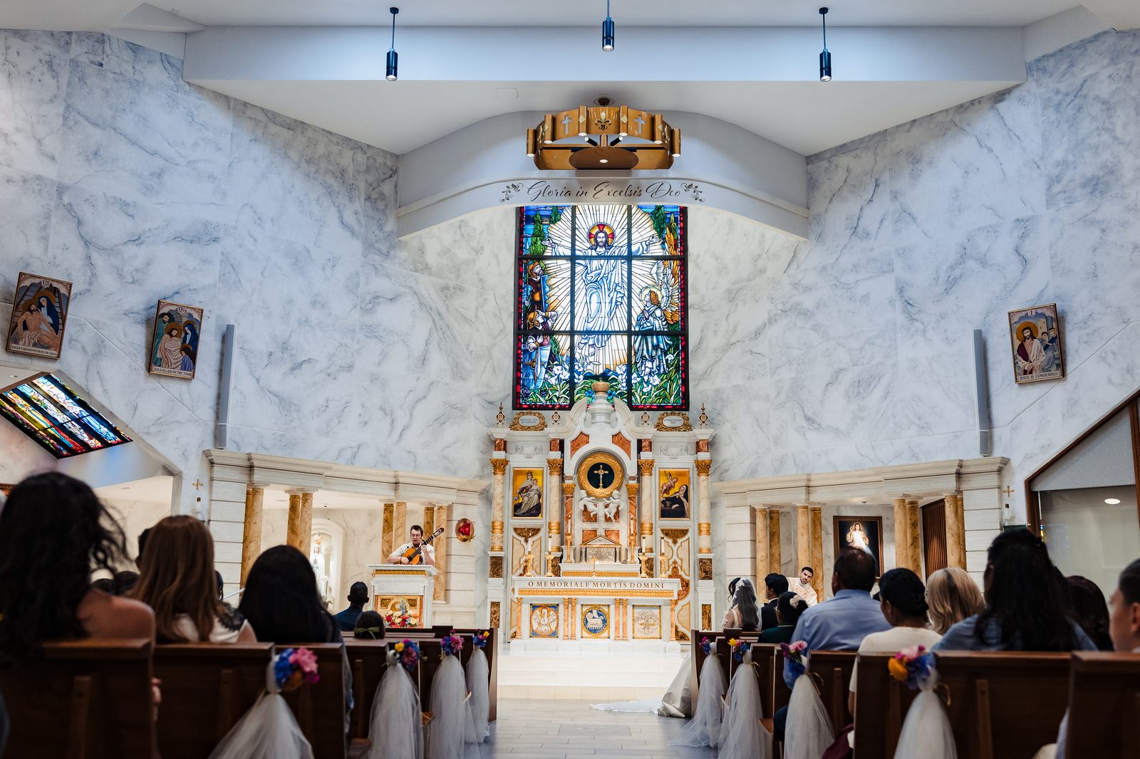 A cantor from the couple's own Neocatechumenal community sings at the lectern during their wedding Mass
