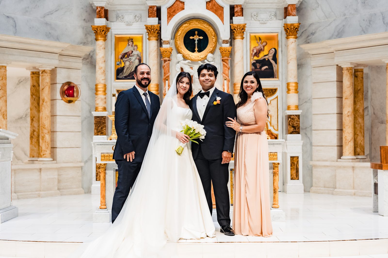 A Neocatechumenal Way couple with their padrinos at the altar