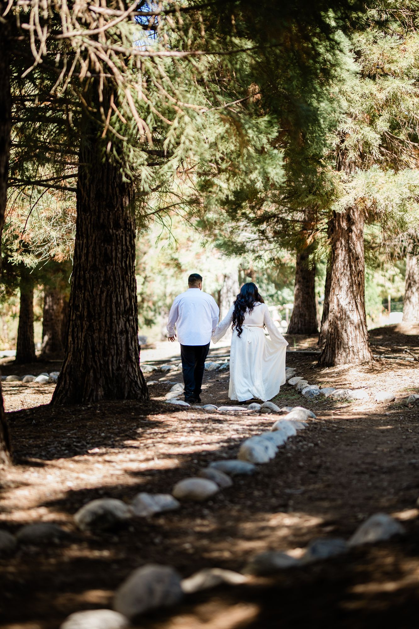 Eric and Cristina on a stone-lined forest trail at Oak Glen Preserve