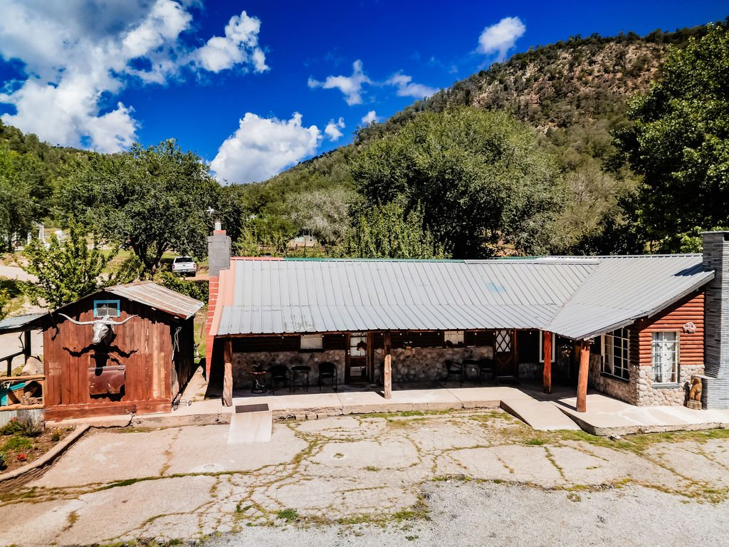 Aerial view of the lodge at Aspen Falls Venue beneath the mountains of Wooten Canyon