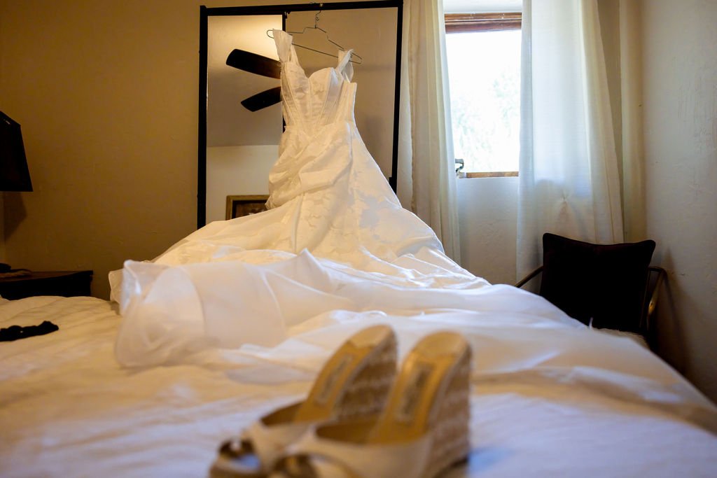 The gown and bridal shoes in the cabin before the ceremony