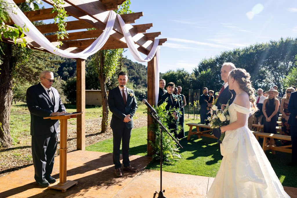 Francis waiting at the arbor as Aubrey arrives