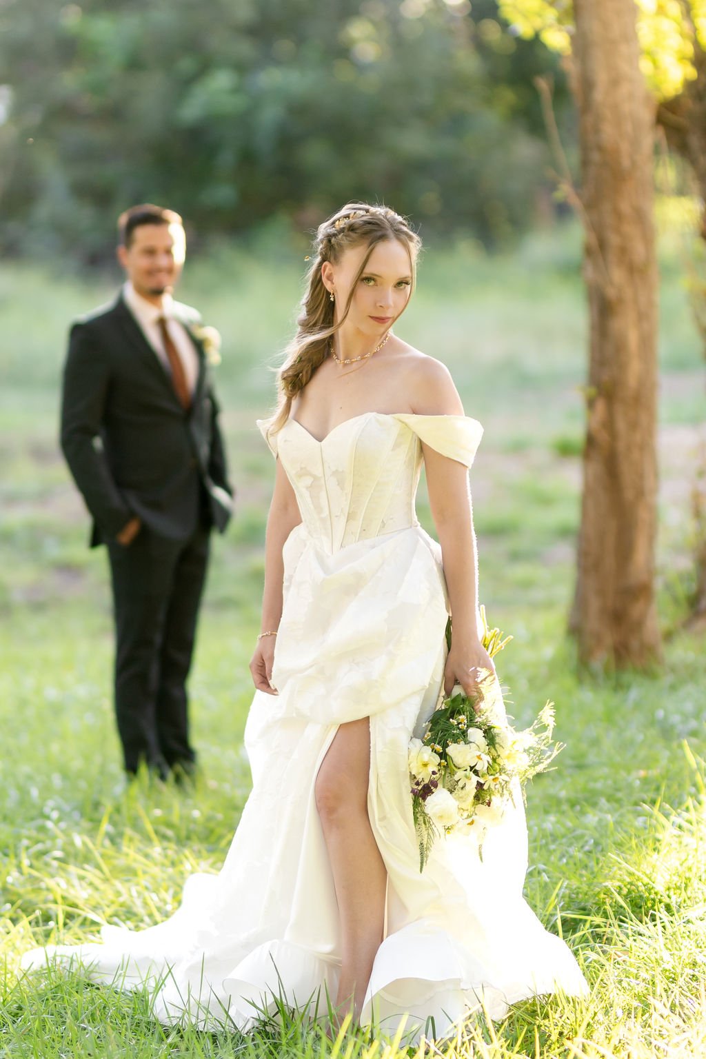 The bride and groom in the meadow in golden light