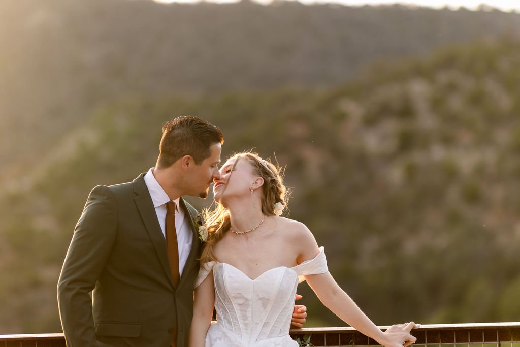 A kiss in golden light above the canyon