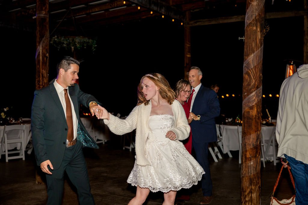 The bride and groom dancing together on the reception floor