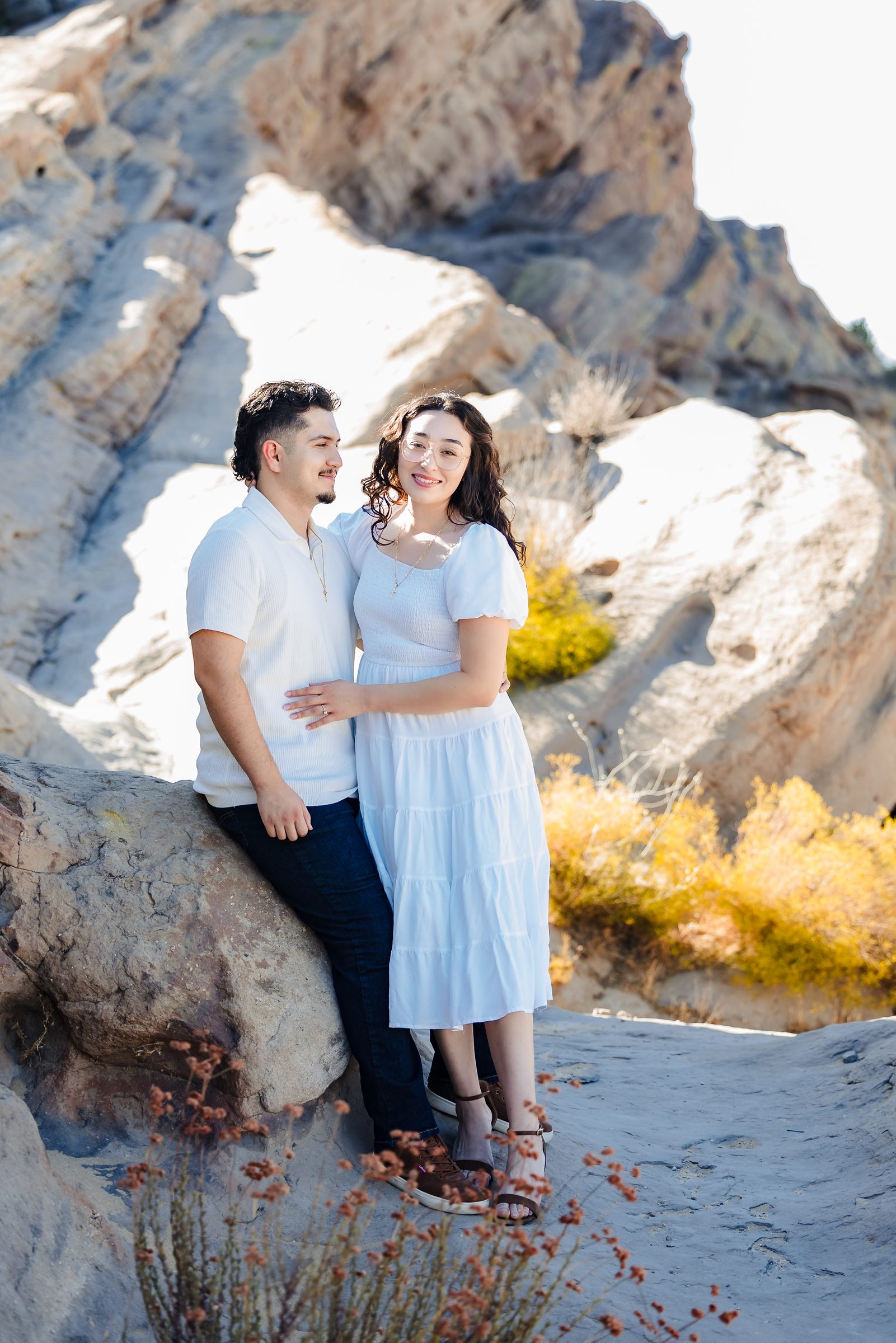 Enrique and Daniela leaning against the sandstone at Vasquez Rocks