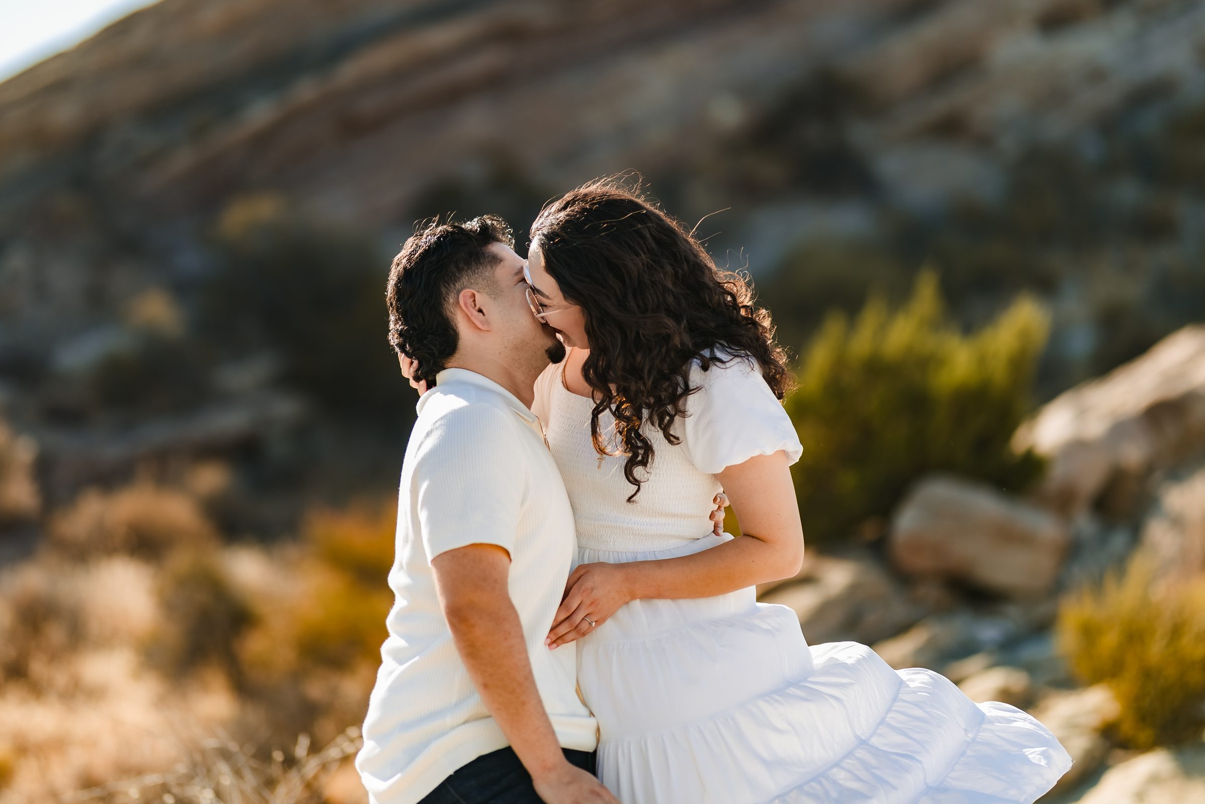 A kiss in front of the sandstone formations