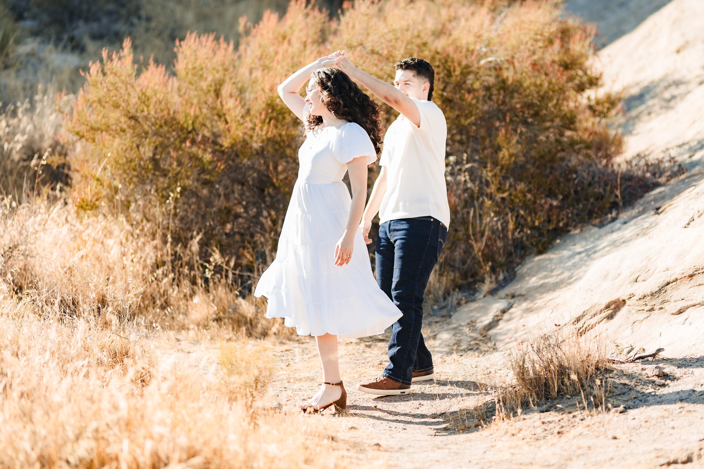 Daniela spinning under Enrique's arm at Vasquez Rocks
