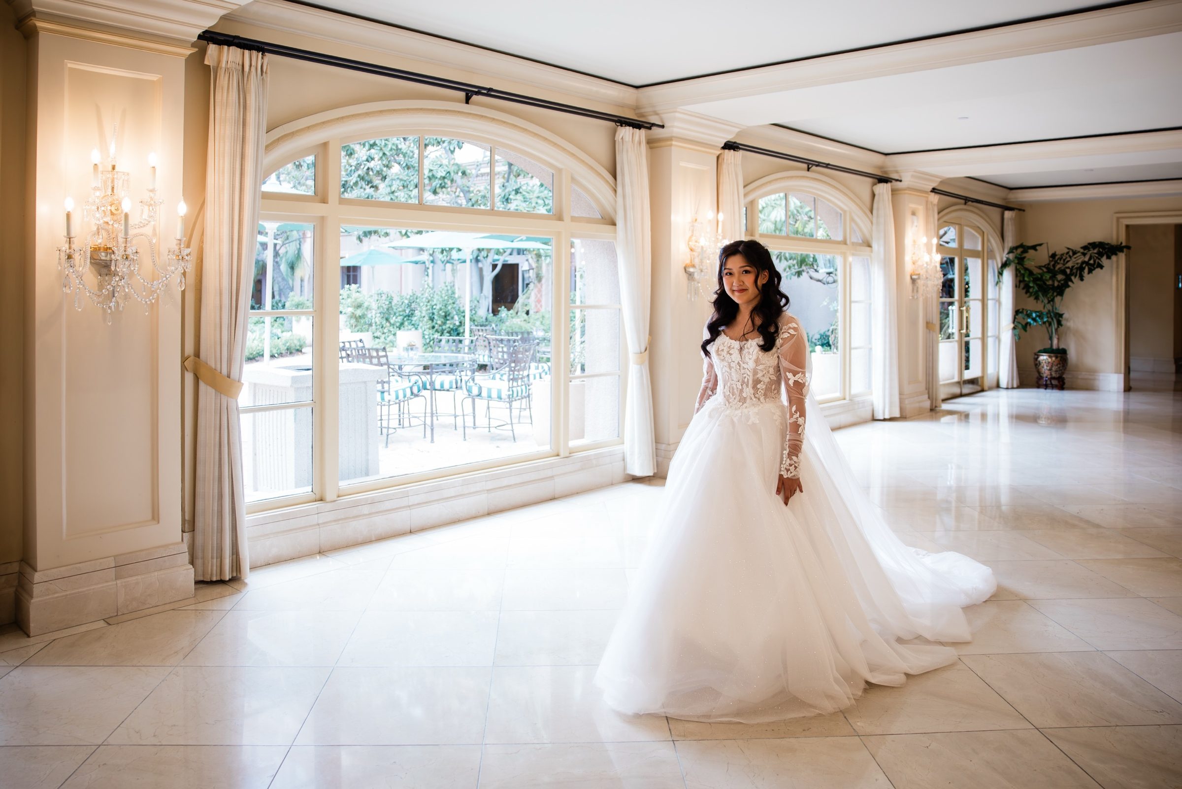Candice smiling in the Langham hall as she leaves for the Mass
