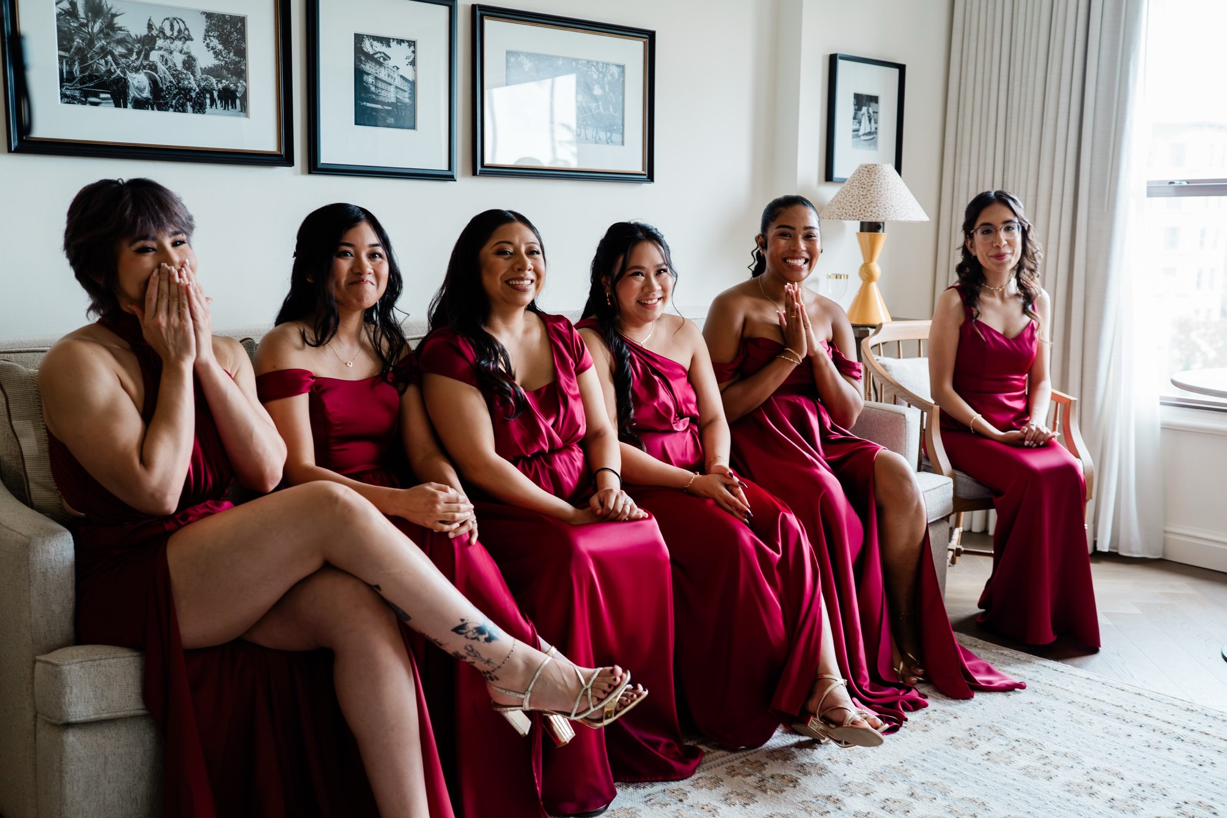 The bridesmaids in red reacting as Candice walks in wearing her gown