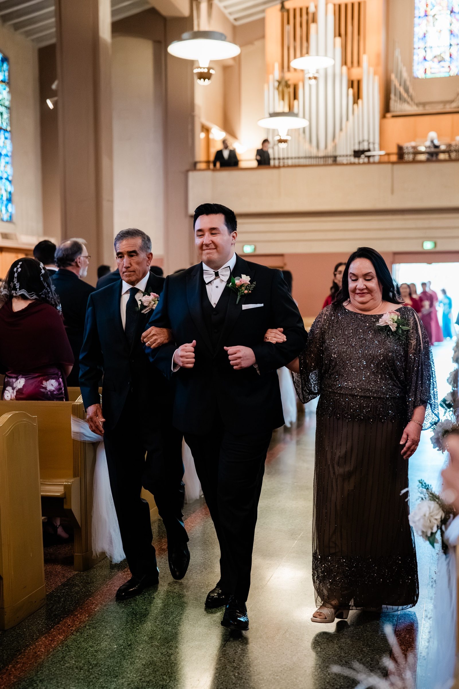 Andrew processing down the aisle with his parents at St. Therese, Alhambra