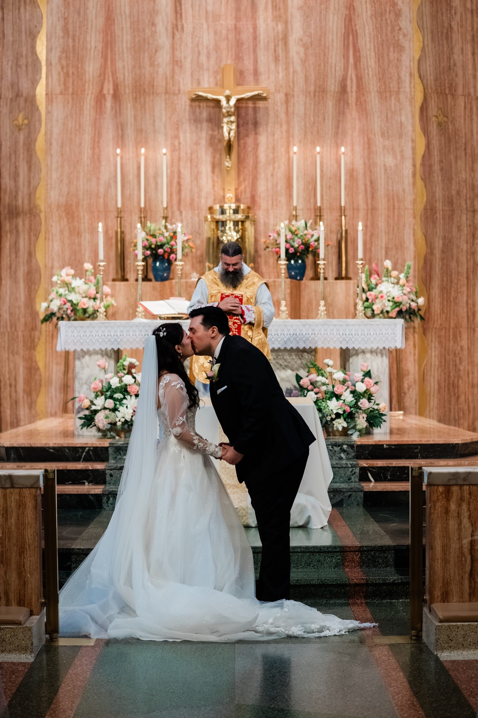 The kiss before the altar and crucifix at St. Therese