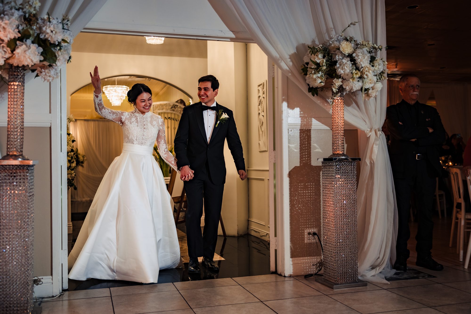 Ben and Vivian's first dance beneath hanging wisteria