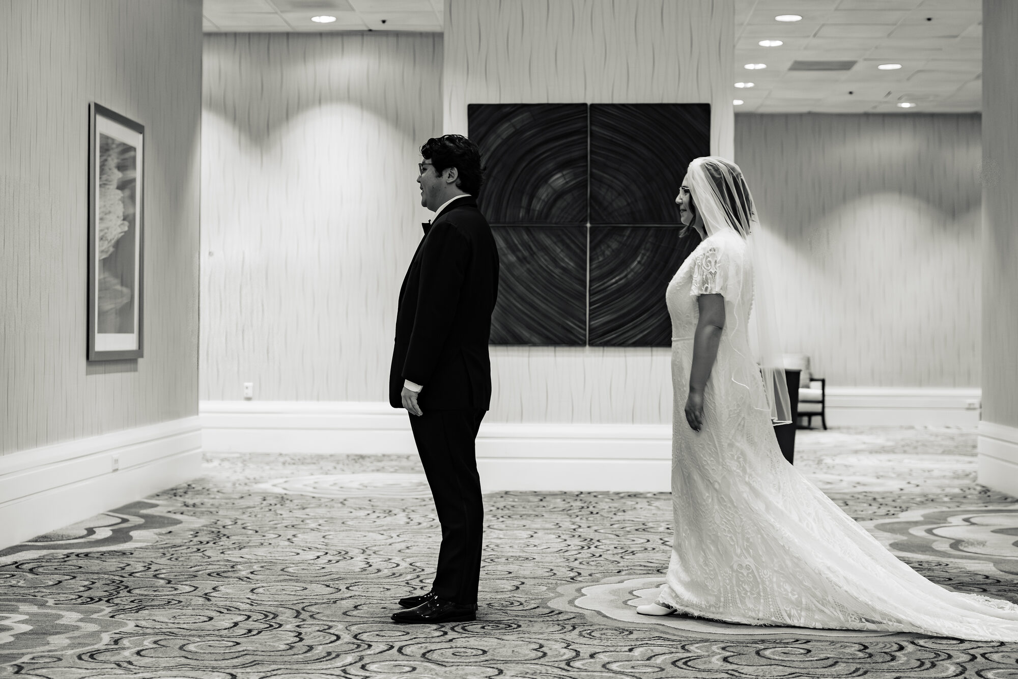 Candid prep moment at the Sonesta hotel before the Catholic wedding