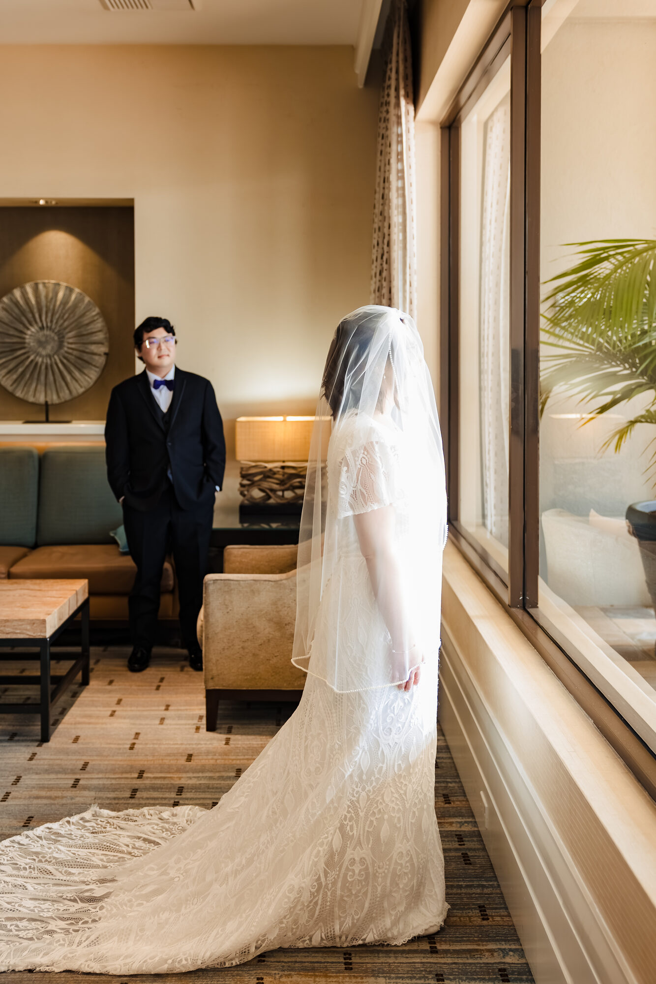 First look between Brett and Kristen before their Catholic wedding