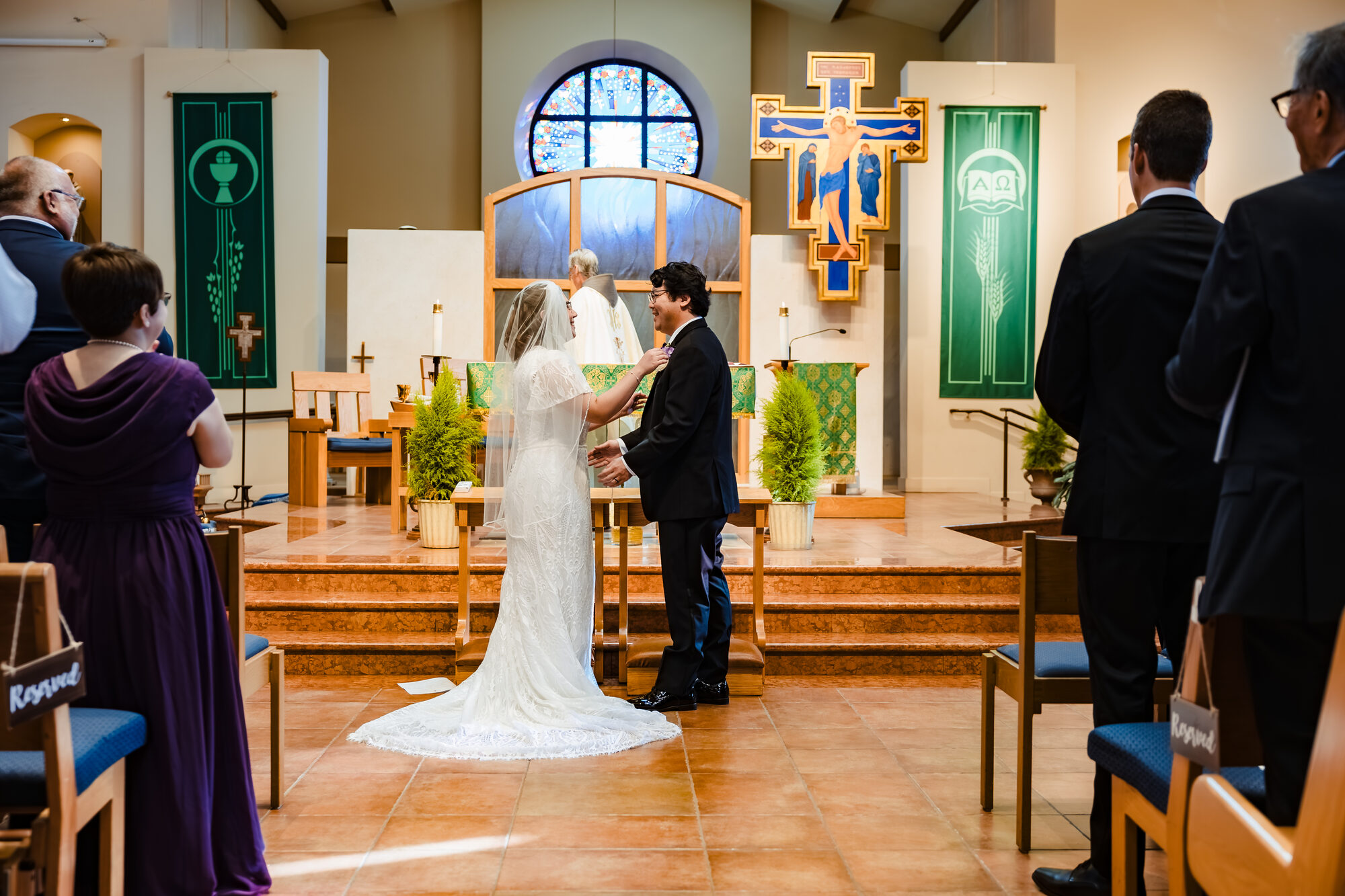 Bride and groom receive a nuptial blessing during the Mass in Hermosa Beach