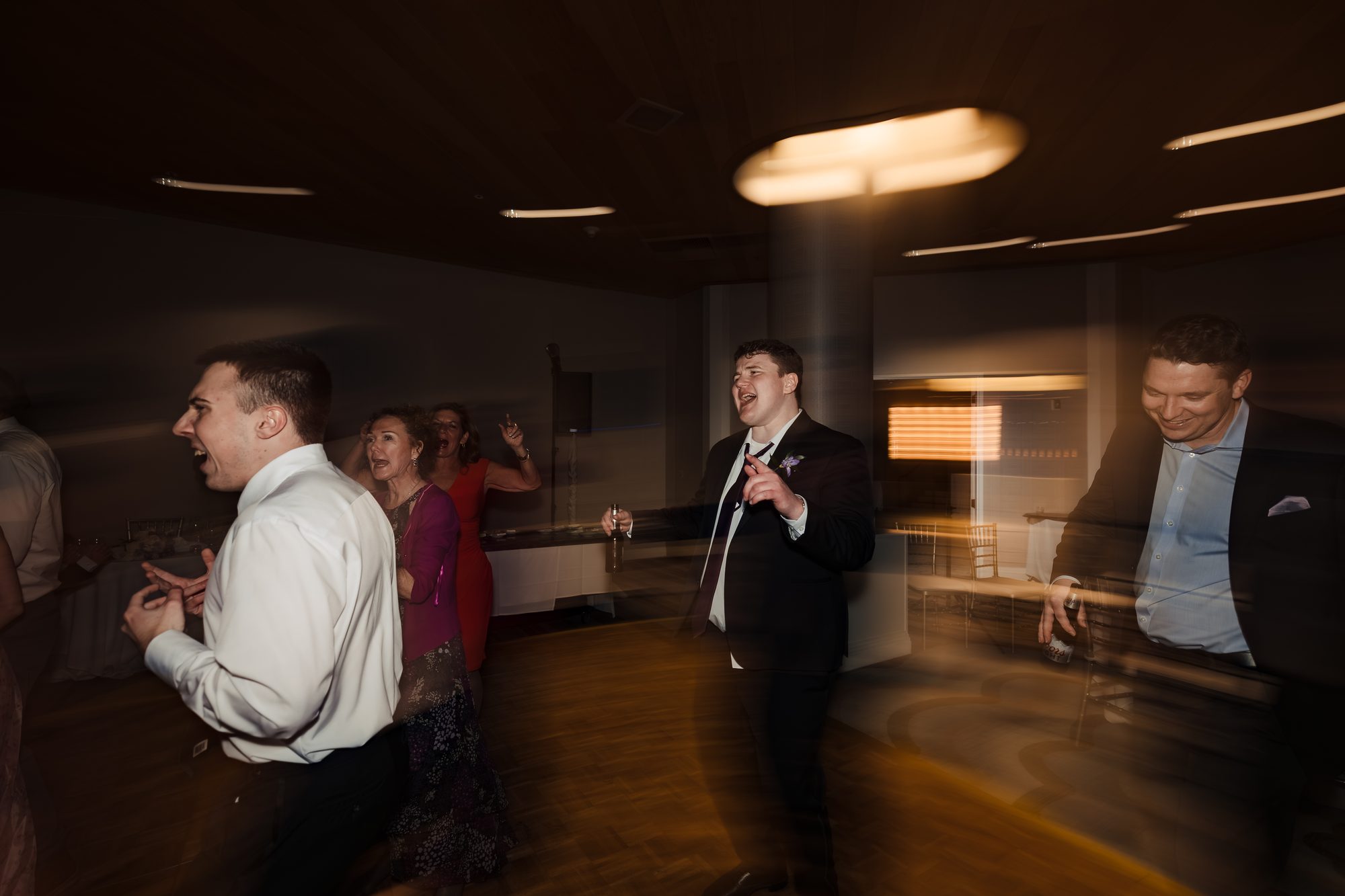 Guests dancing and celebrating at the Hermosa Beach Catholic wedding reception