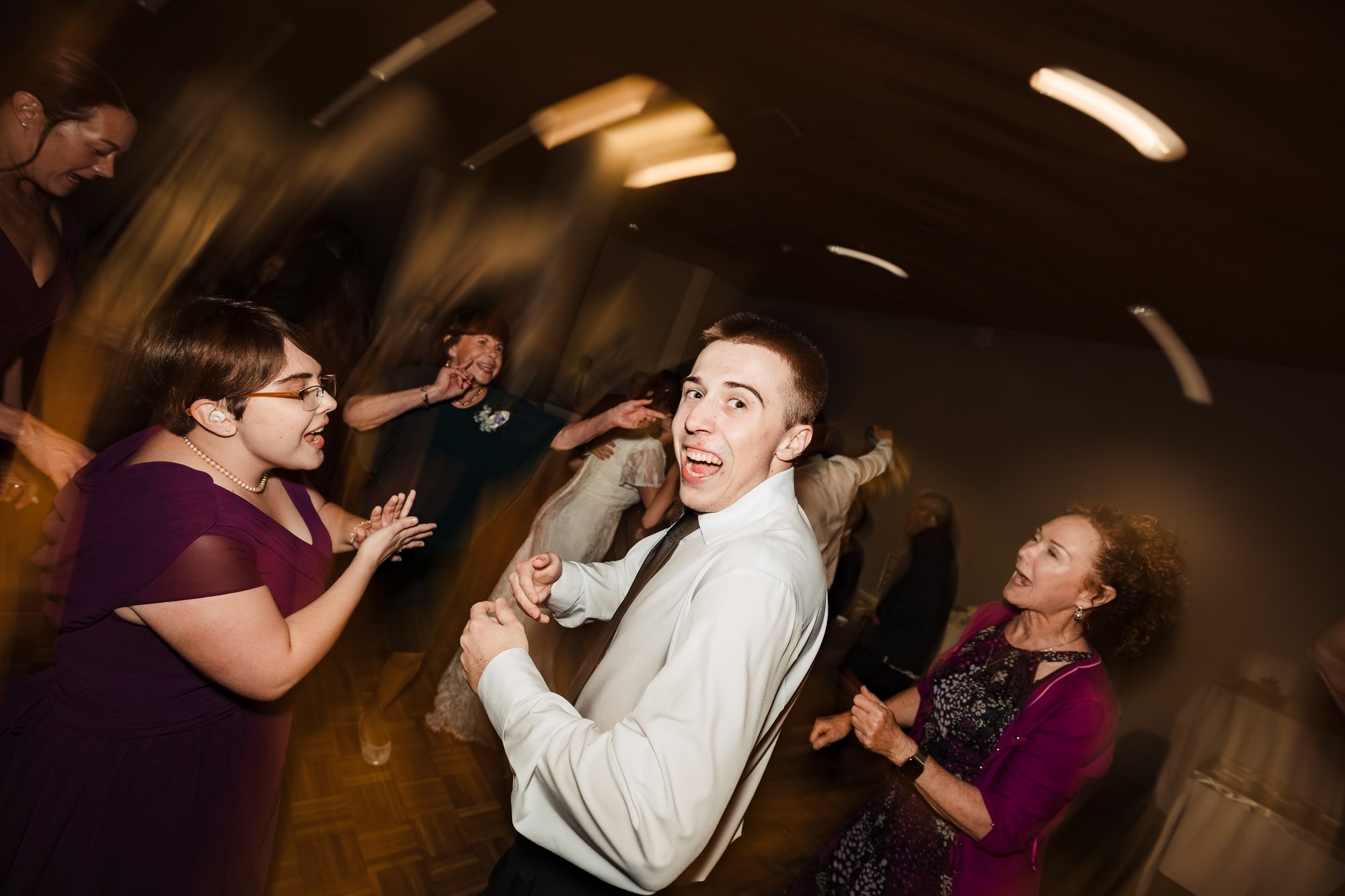 High-energy dance floor moment at the Sonesta wedding reception