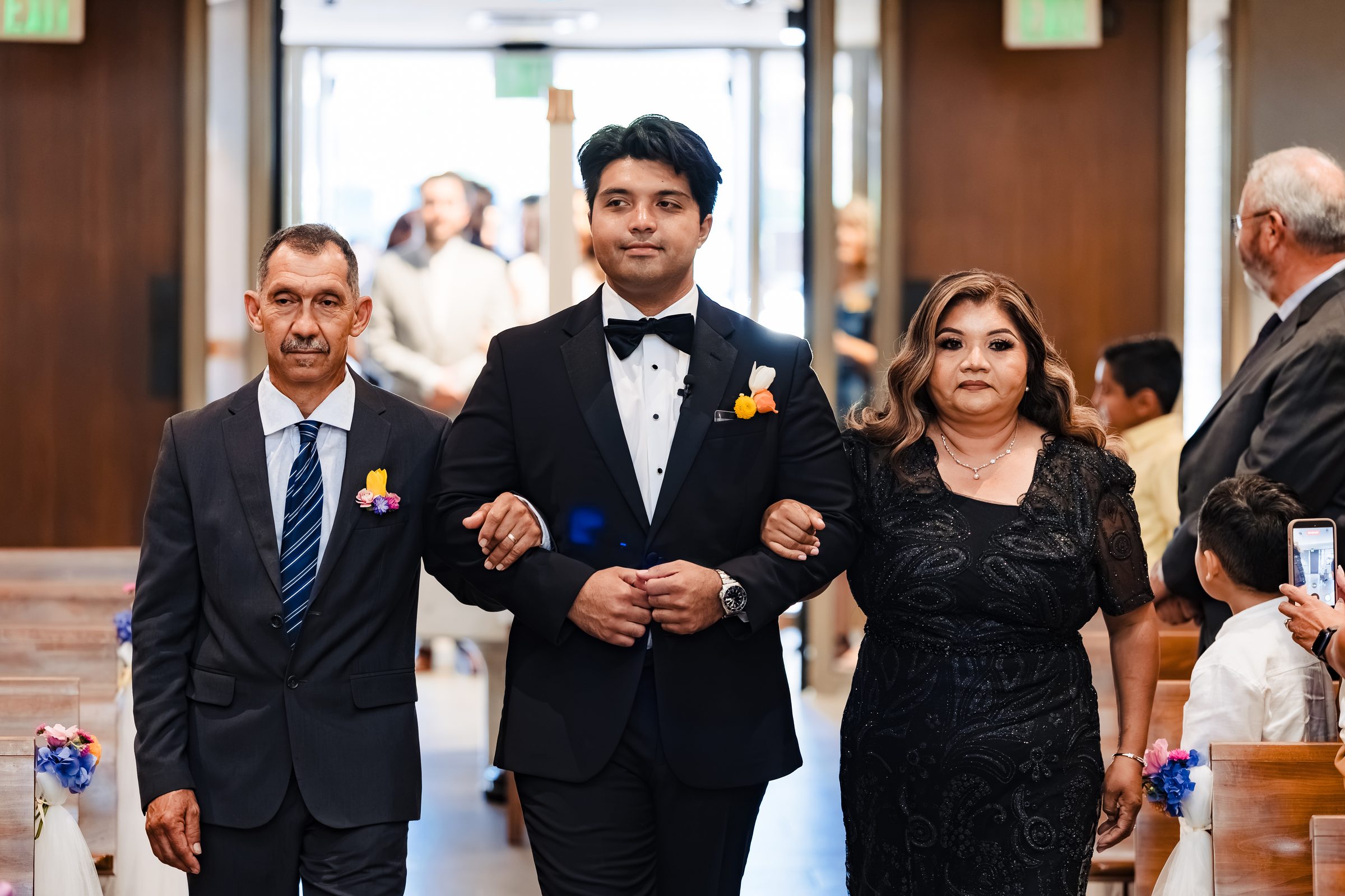 Diego escorted down the aisle by his parents at Saint Martin de Porres, Yorba Linda