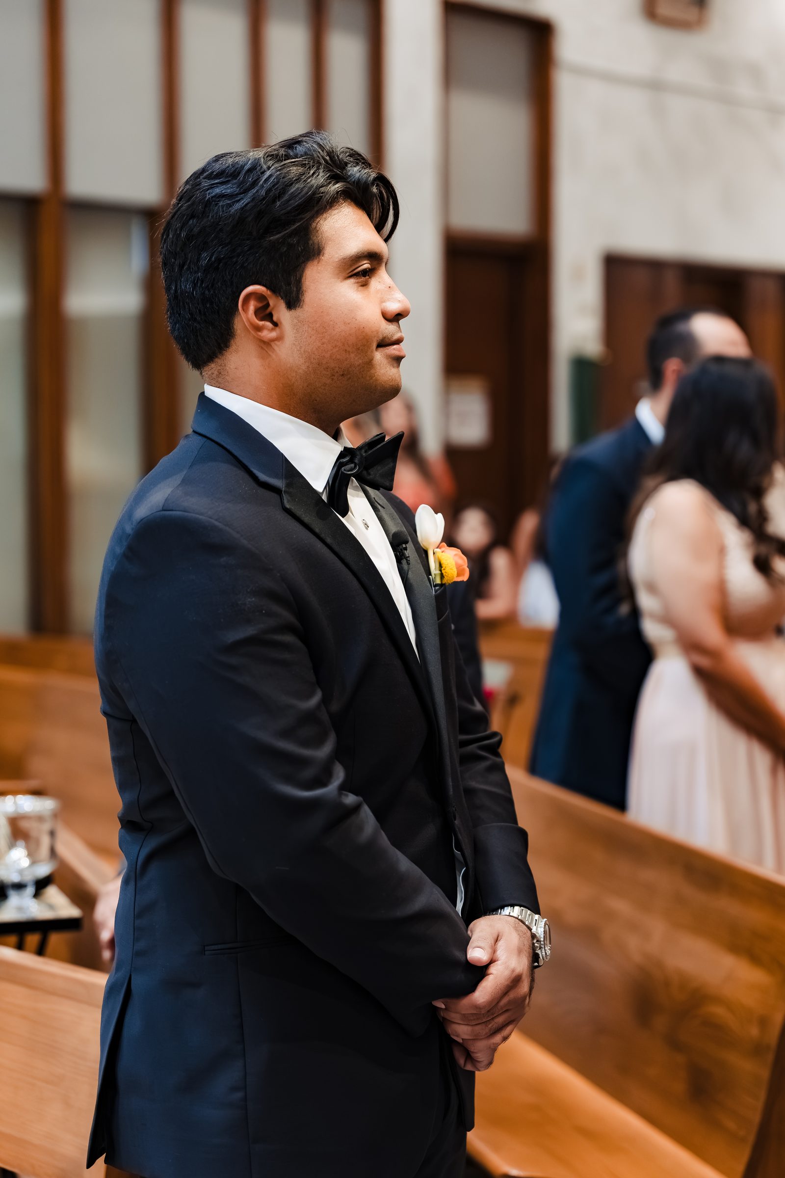 Diego waiting at the front of the church for his bride
