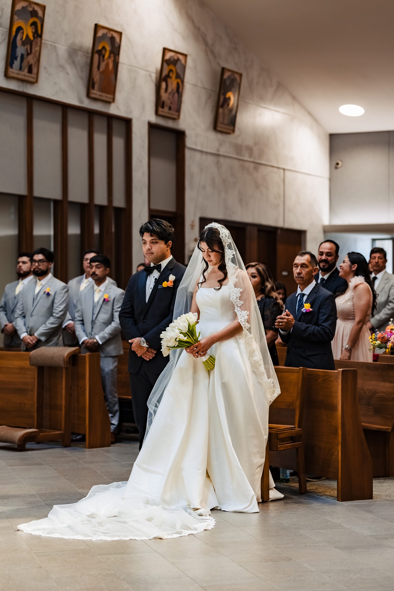 Judith walking toward the altar with her cathedral-length train