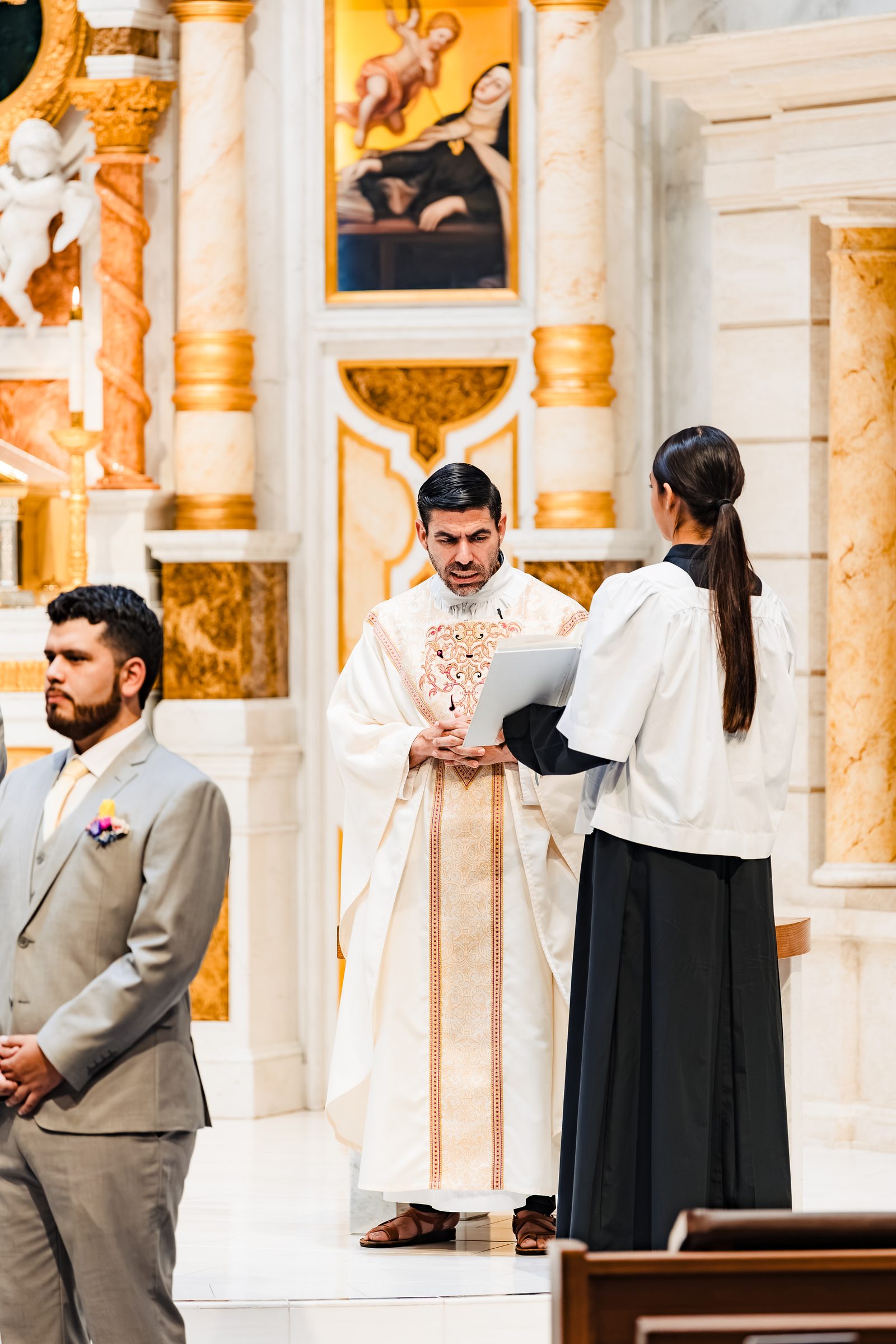 The priest with a reader at the start of the Liturgy of the Word