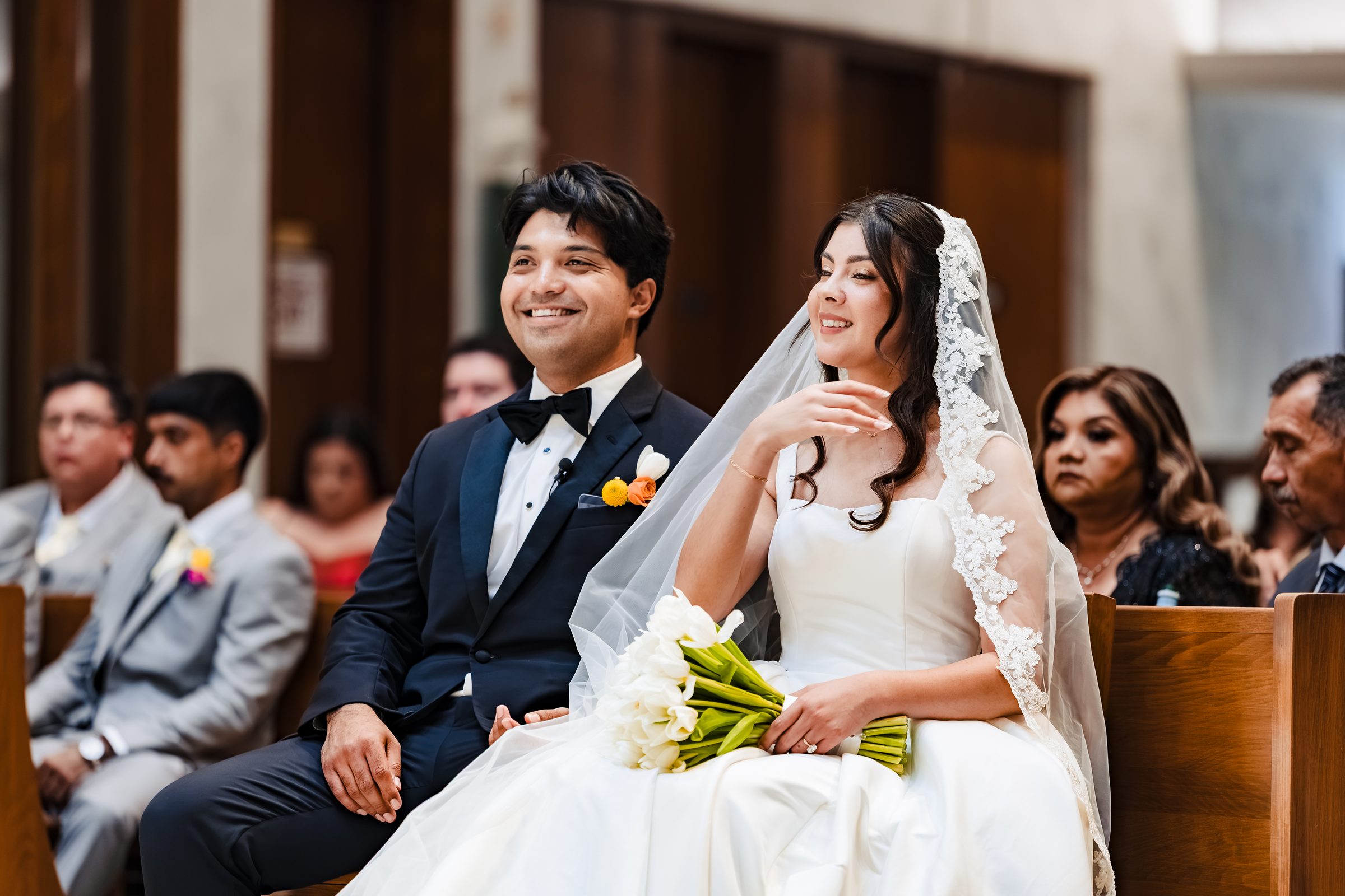 Diego and Judith smiling together in the front pew