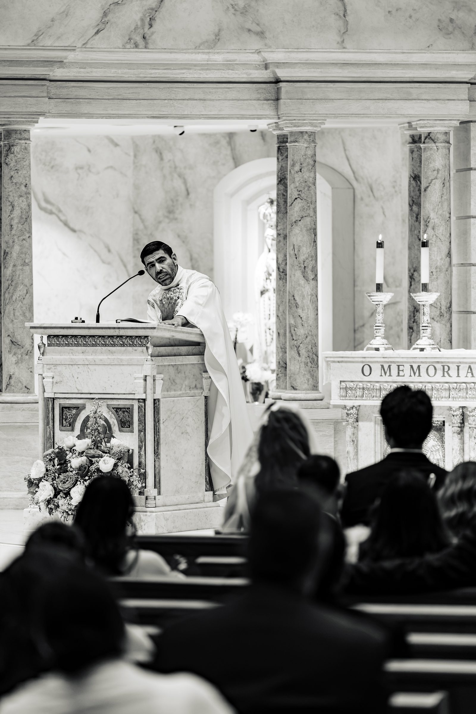 Black and white of the homily from the ambo