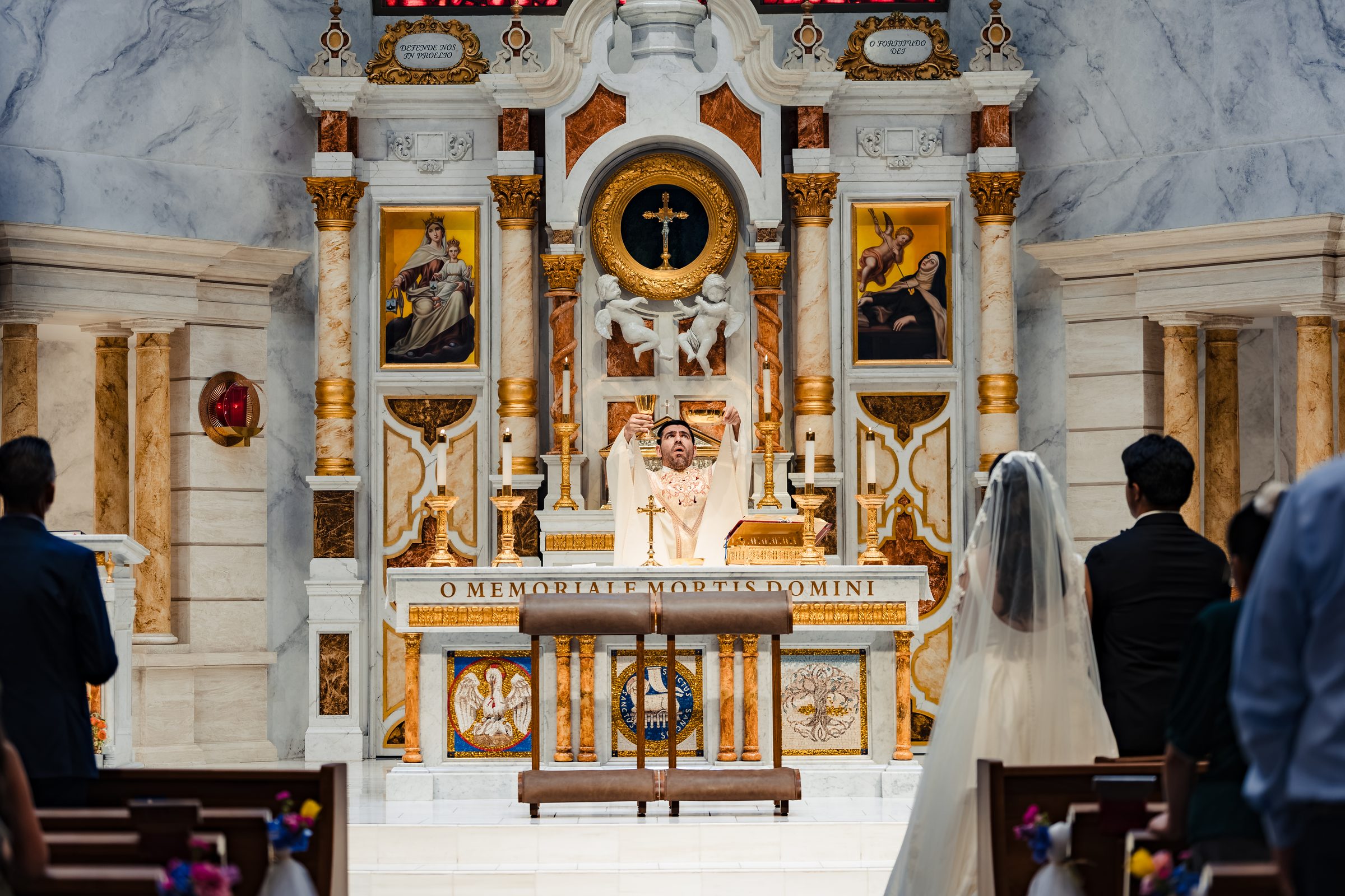 The consecration seen over the couple's shoulders