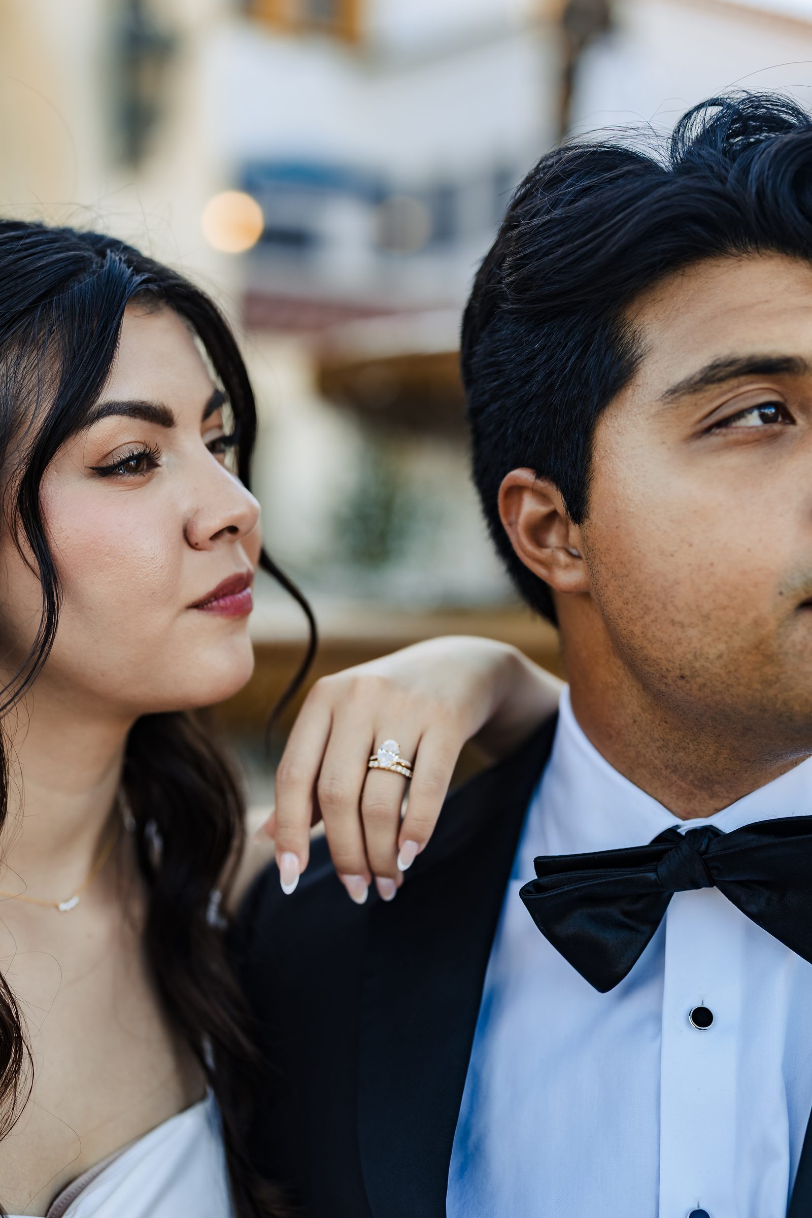 Close portrait showing Judith's ring on Diego's shoulder