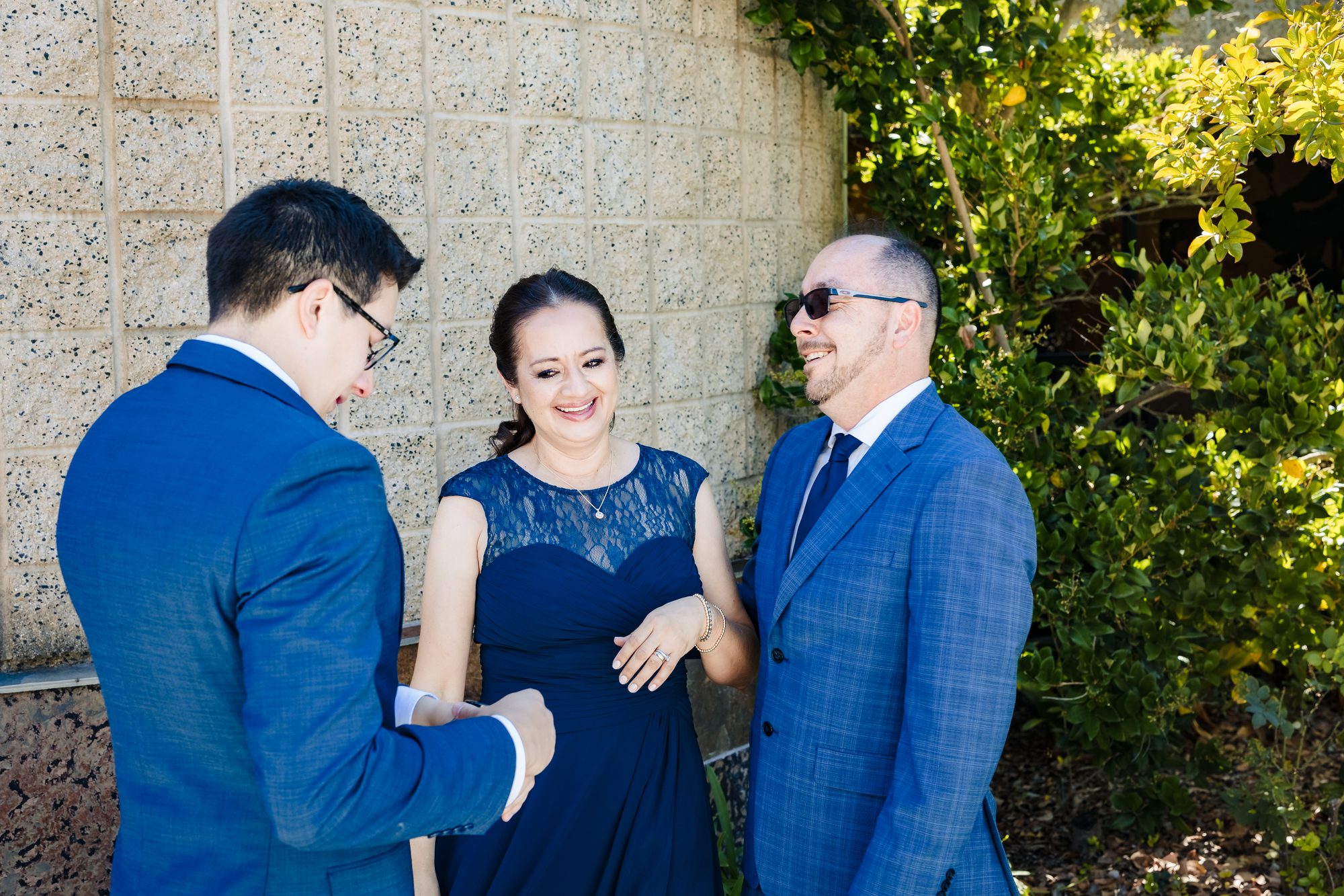 The groom's parents help with final details