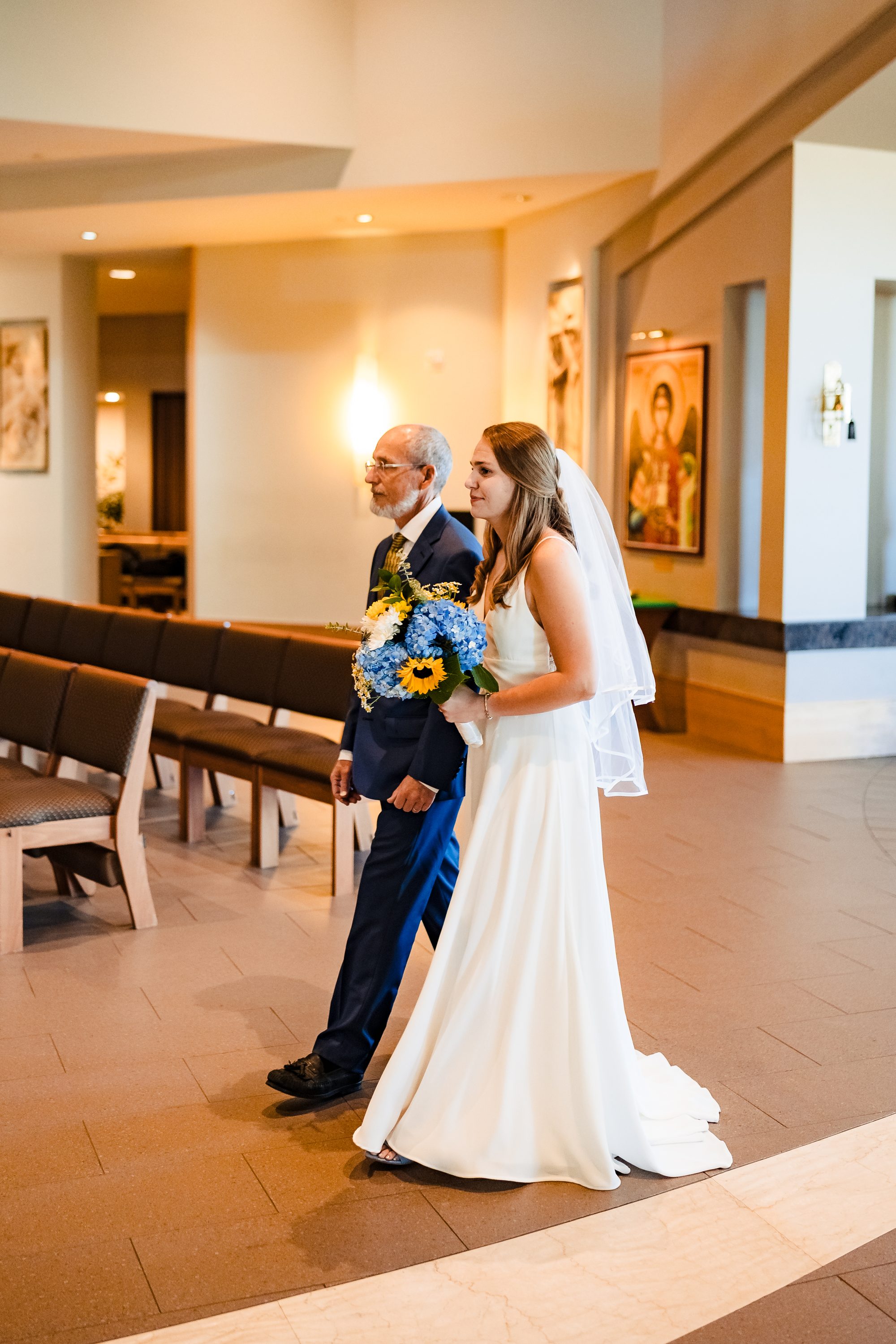 The groom processes in with his mother