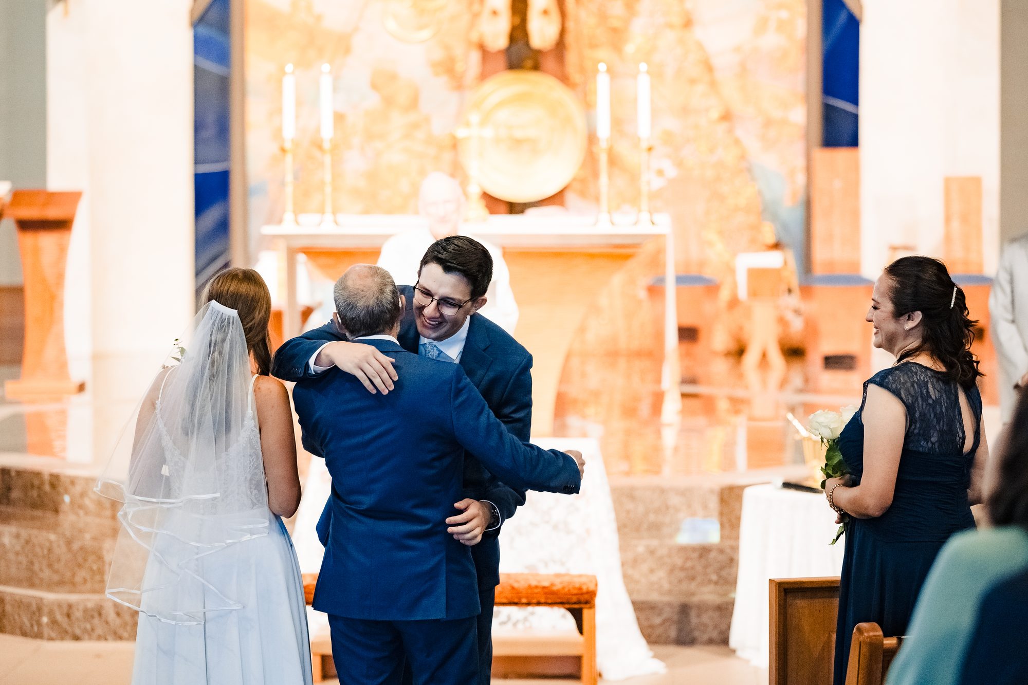 The couple at the altar before the crucifix