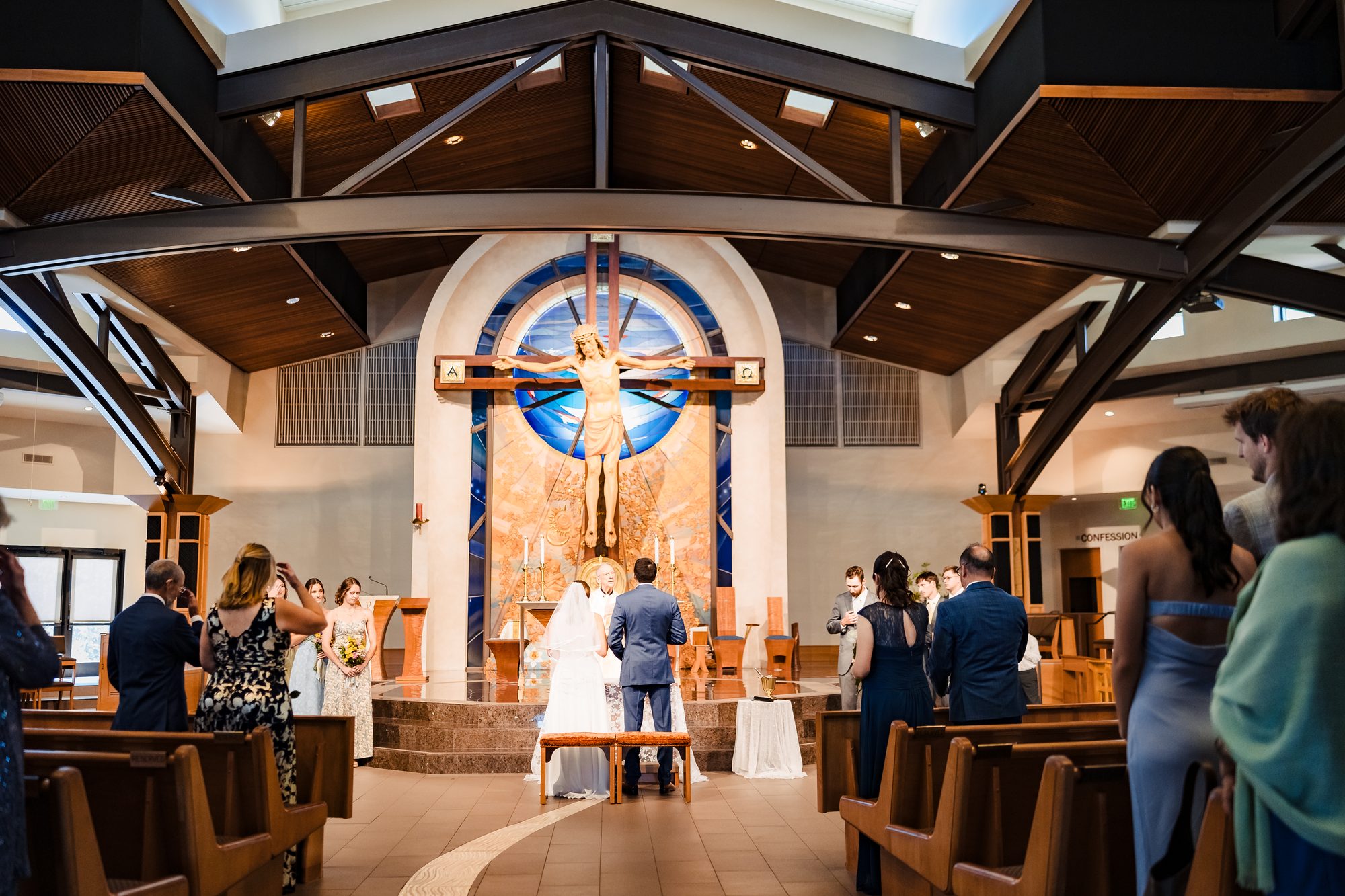 The bride and her father walk up the aisle