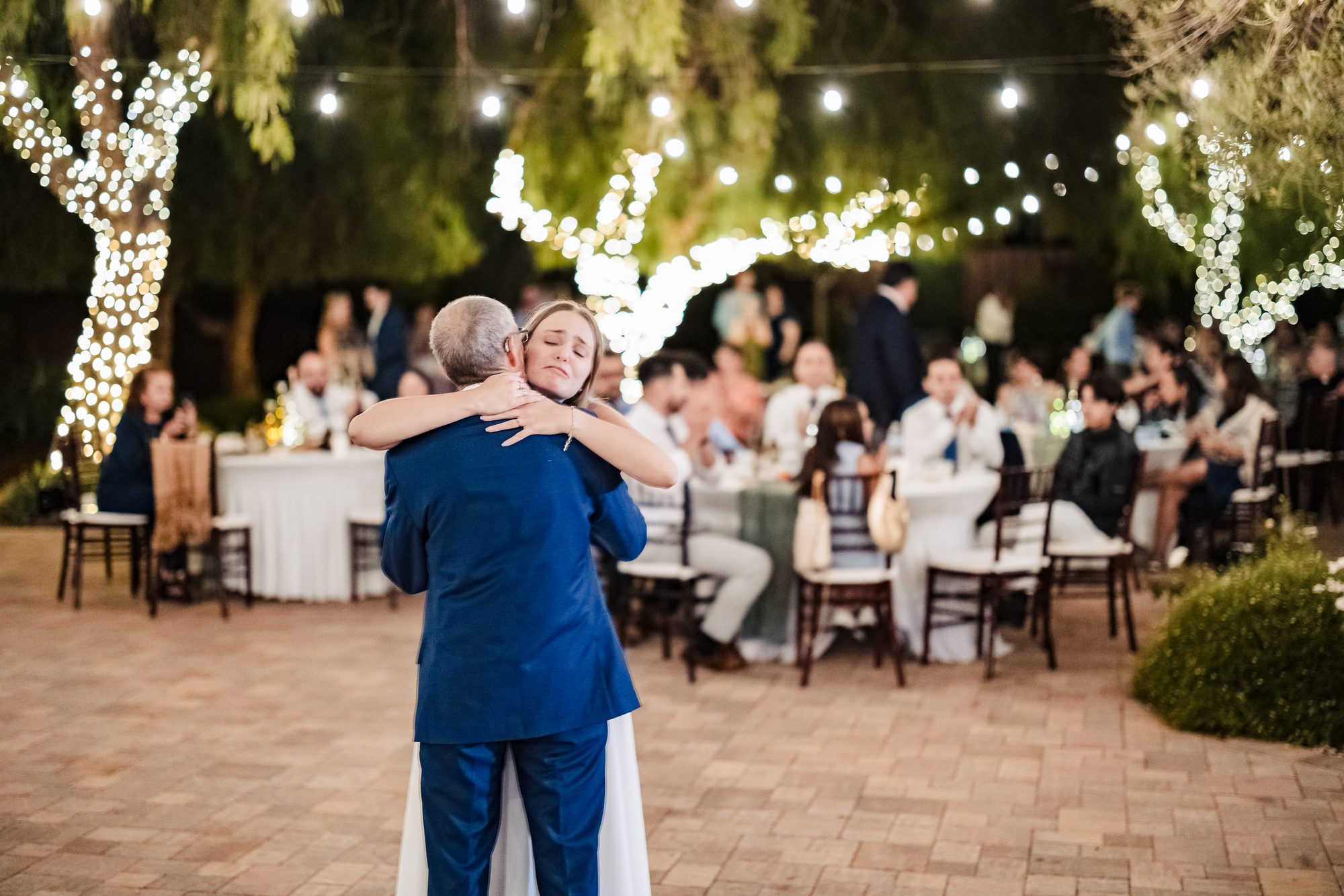 A toast at the sunflower-lined head table