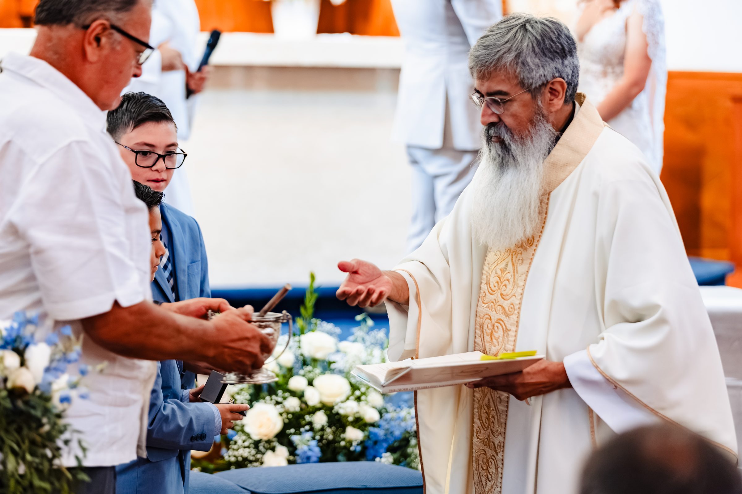 Father Randy blessing during the wedding Mass