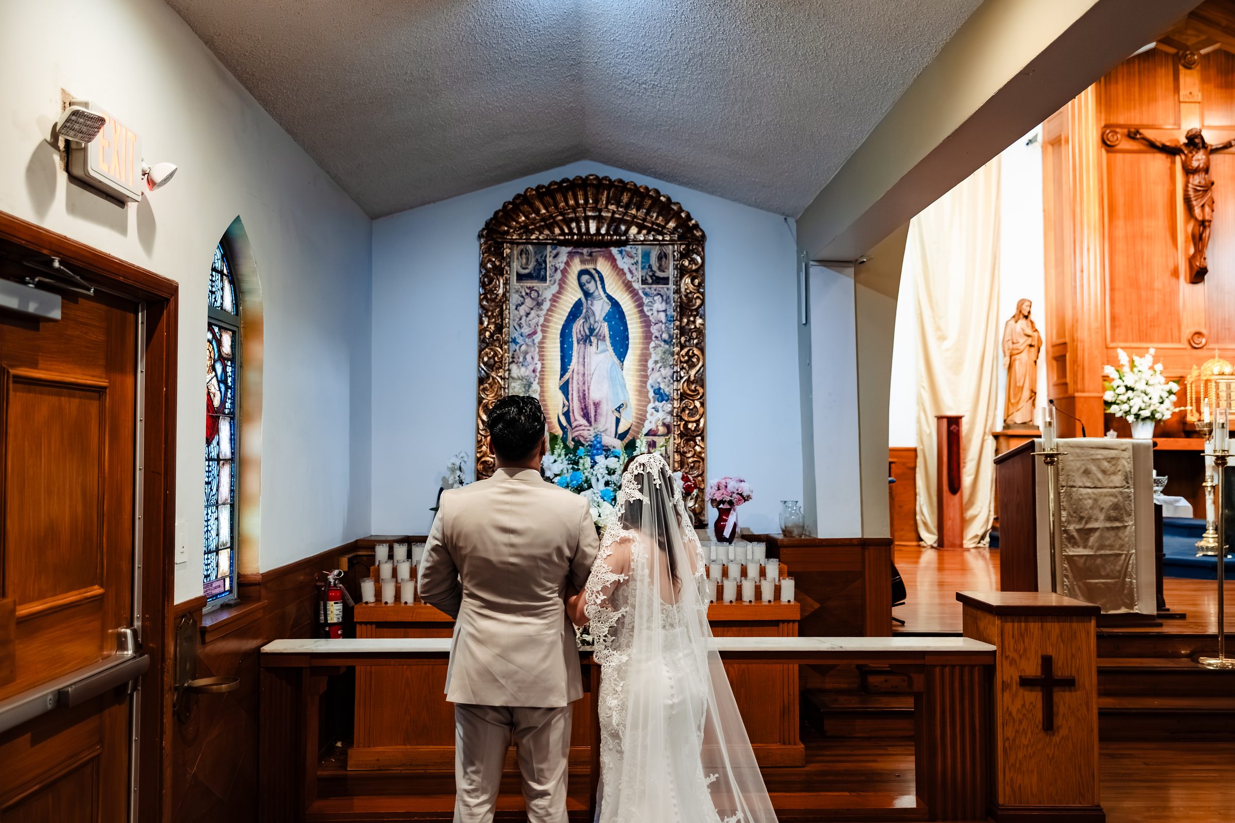 The couple in prayer at the Our Lady of Guadalupe shrine